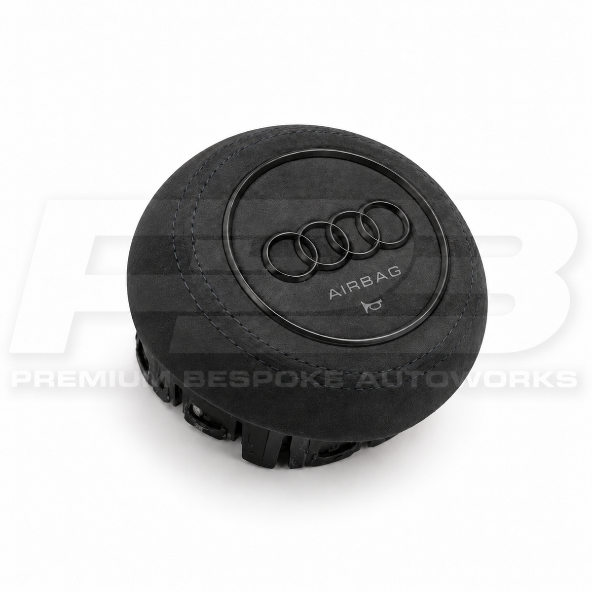 Audi RS3 8V custom airbag cover in black leather, angled view showing the fit over the original airbag unit