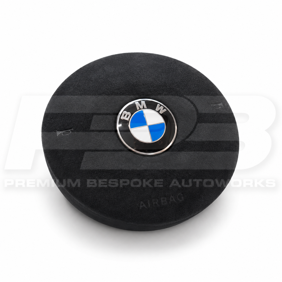 BMW M3 F80 custom airbag cover in black Alcantara with black stitching, front view, replaces the original plastic cover