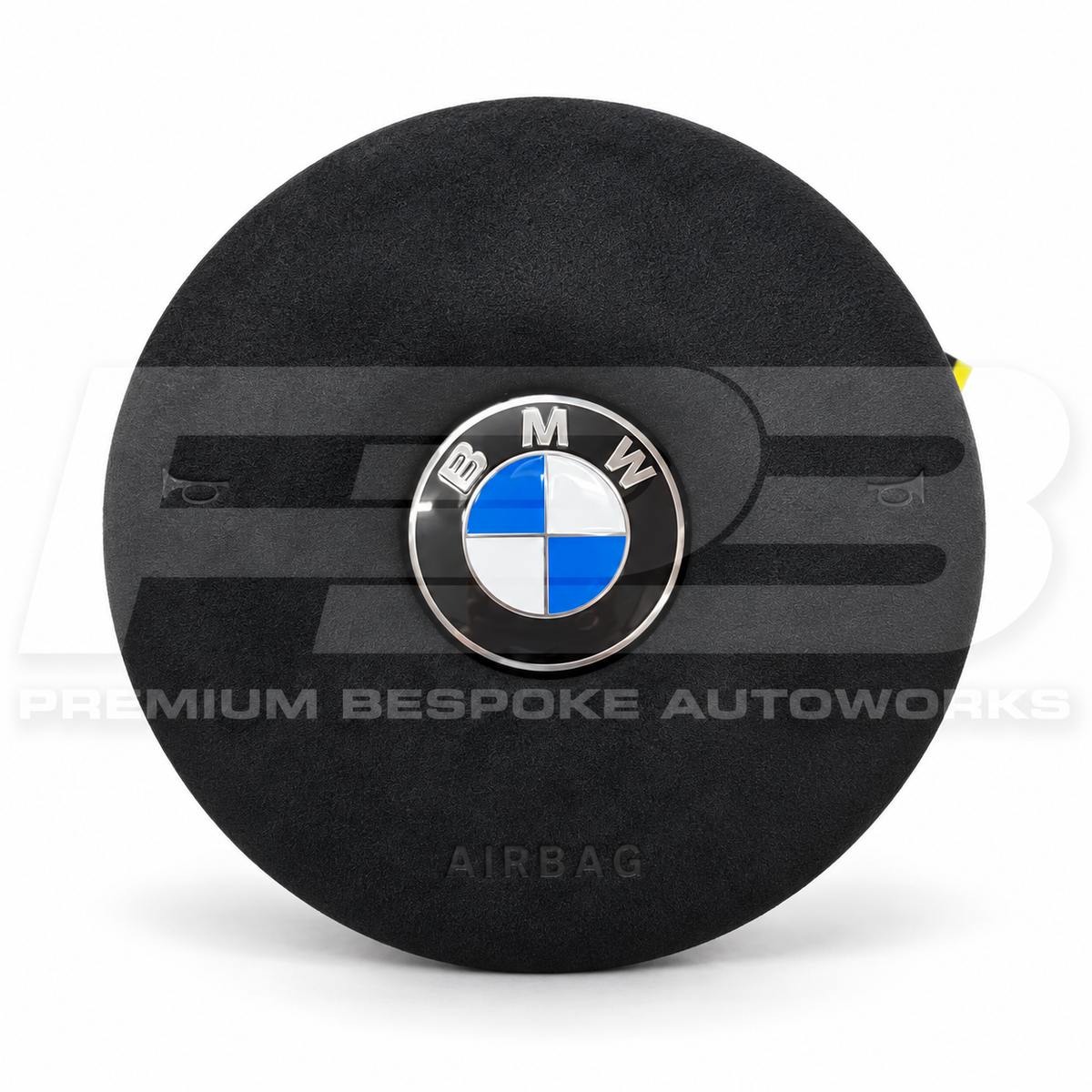 BMW M3 F80 custom airbag cover in black Alcantara, angled view showing the fit over the original airbag unit