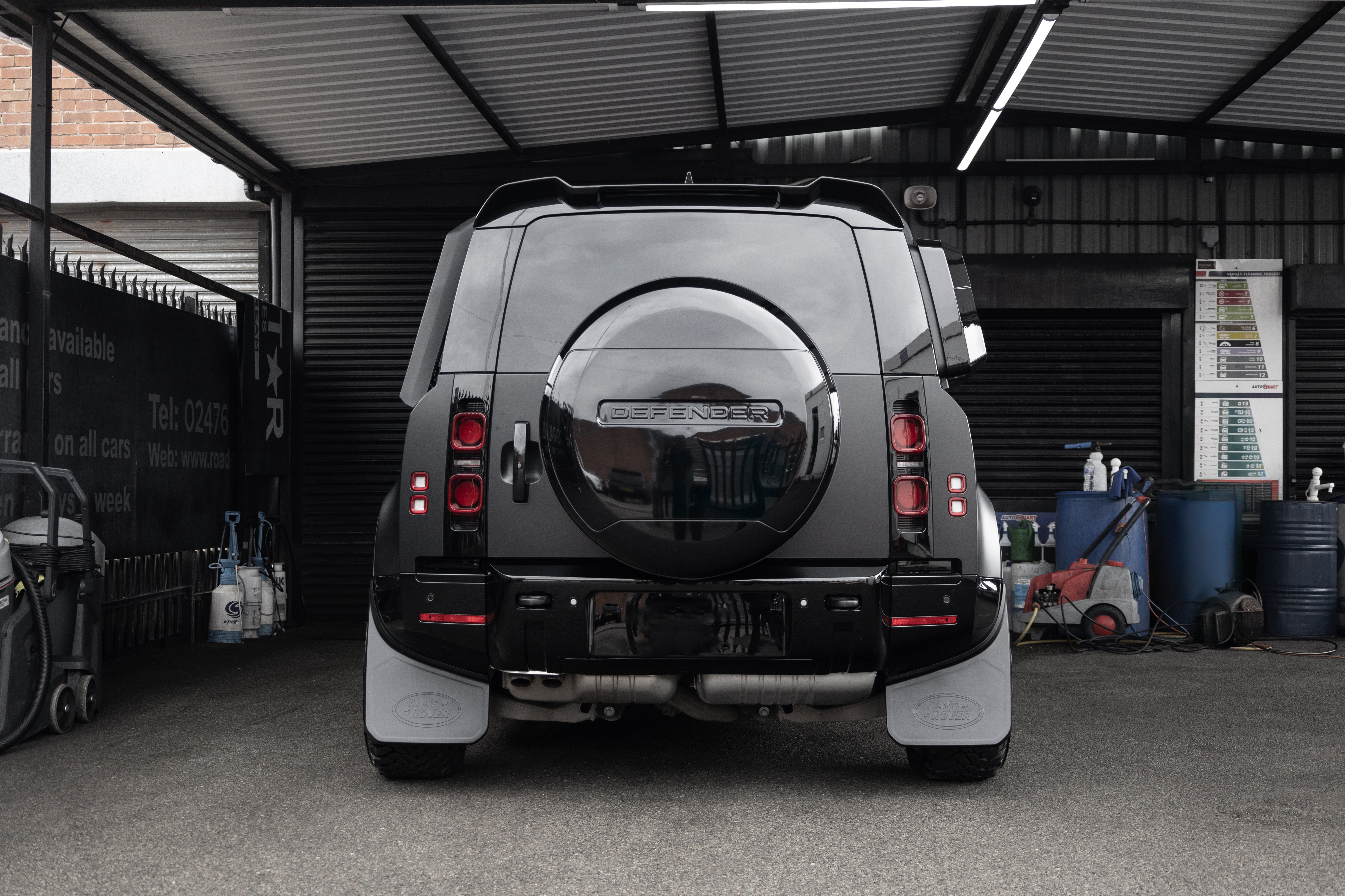 Defender gloss black rear bumper trim set