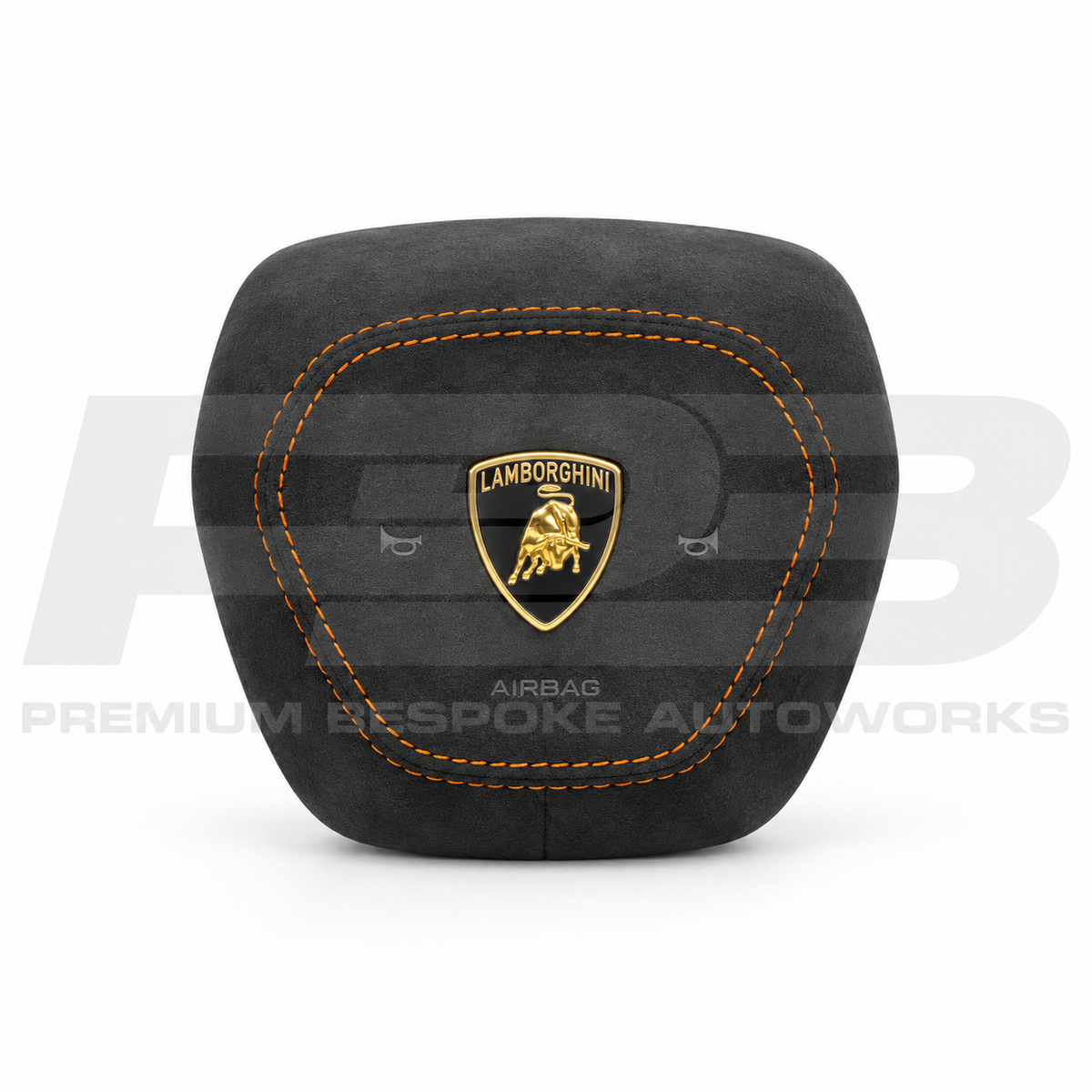 Lamborghini Urus custom airbag cover in black Alcantara with orange contrast stitching, replaces the original plastic cover