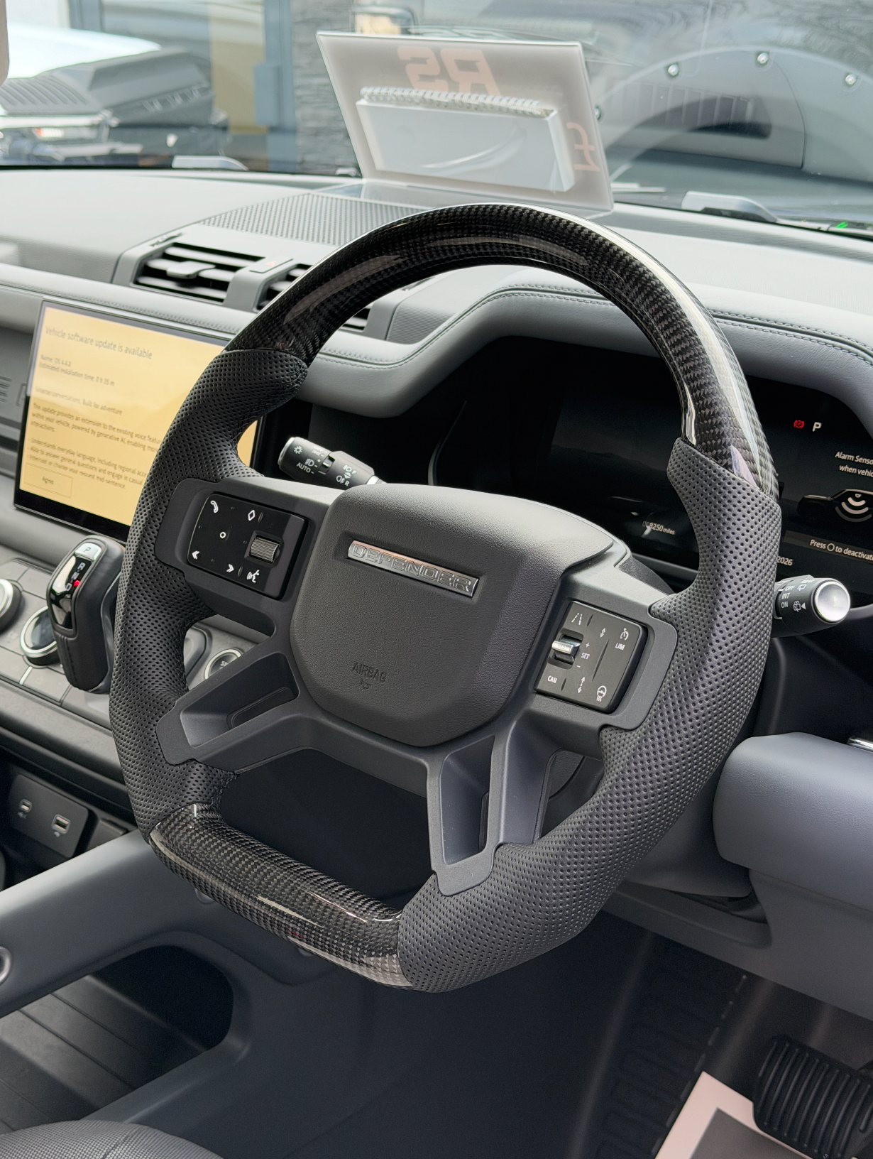 Land Rover Defender L663 Custom Steering Wheel with black trim fitted to vehicle