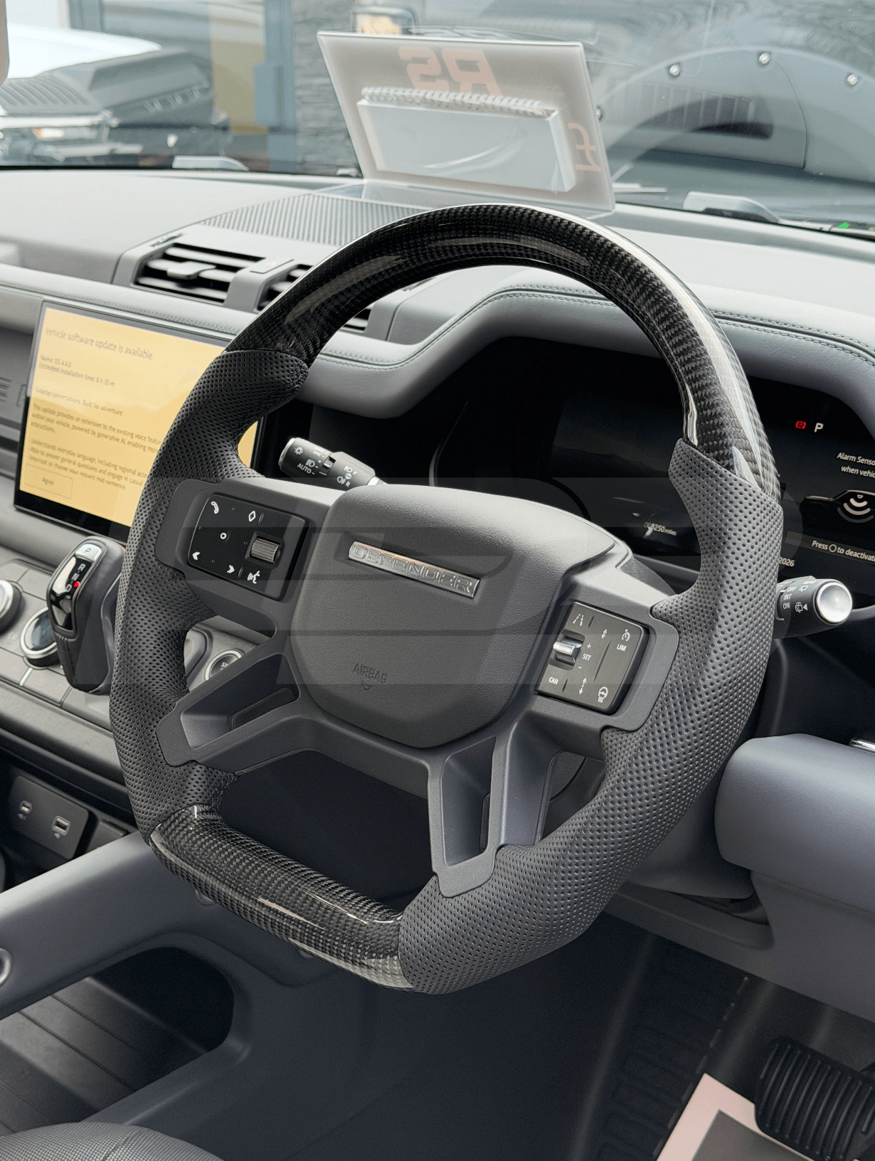 Land Rover Defender L663 Custom Steering Wheel with black trim fitted to vehicle