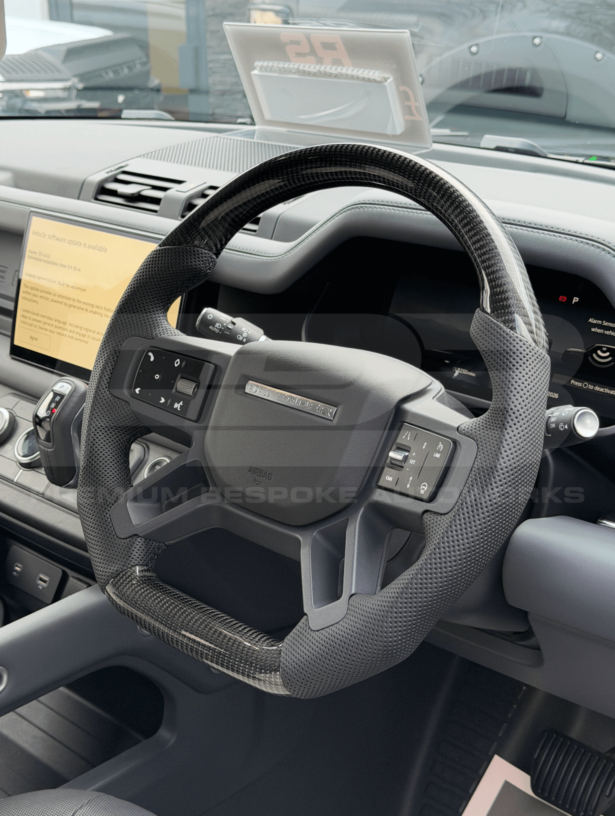 Land Rover Defender L663 Custom Steering Wheel with black trim fitted to vehicle