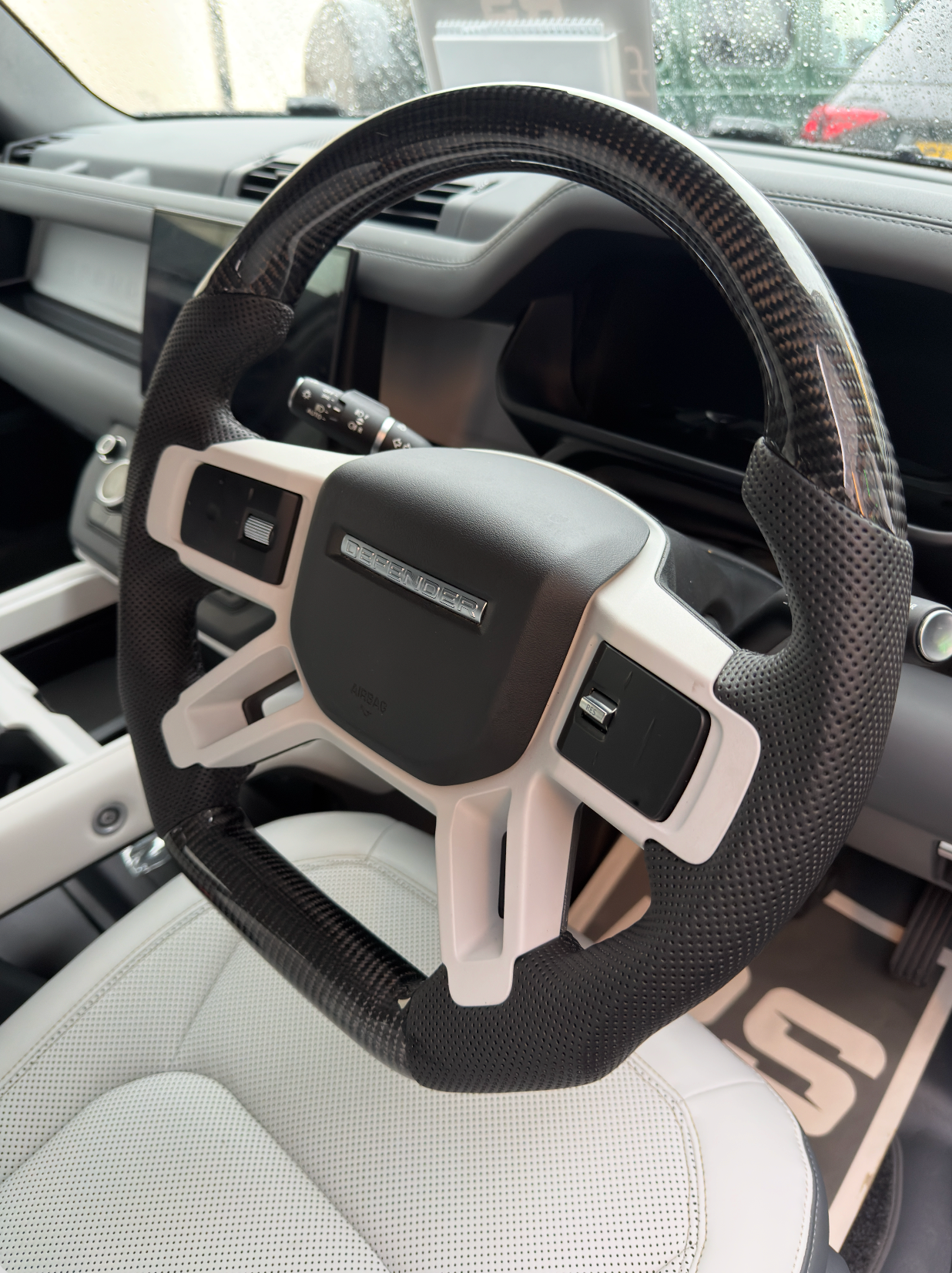 Land Rover Defender L663 Carbon Fibre Steering Wheel installed on vehicle