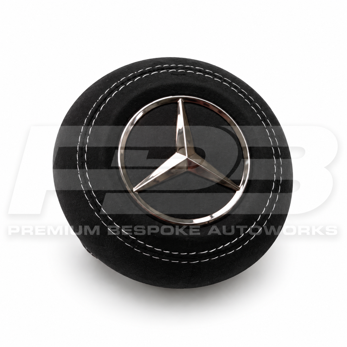 Mercedes C63 AMG W206 custom airbag cover in black Alcantara with white contrast stitching, front view, replaces the original plastic cover