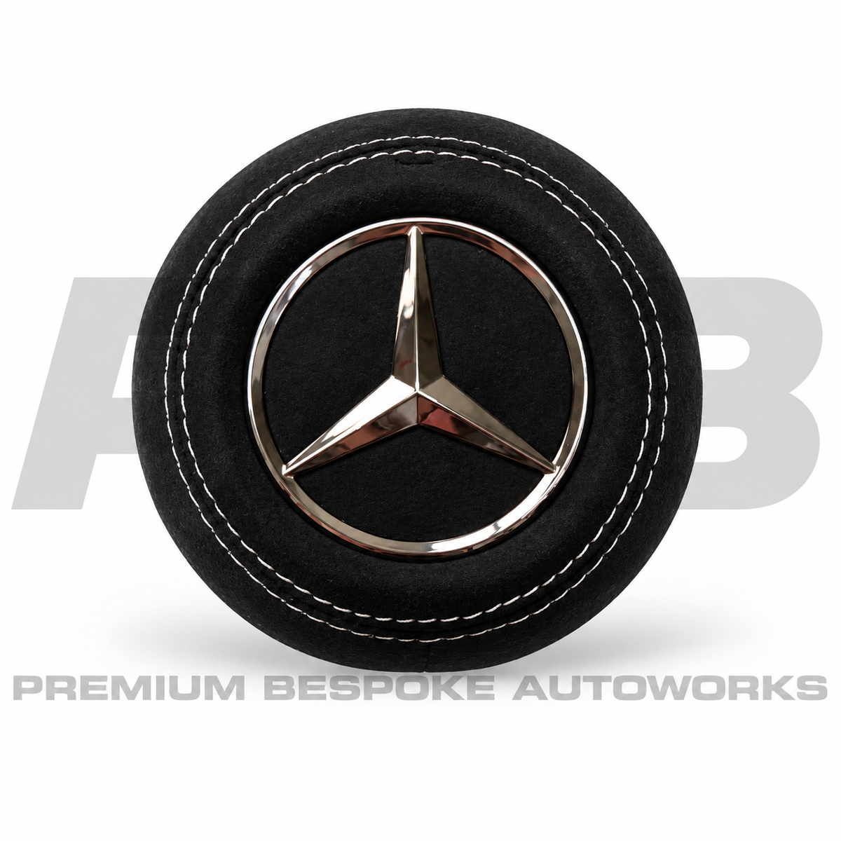 Mercedes-AMG CLE 53 C236 custom airbag cover in black Alcantara with white contrast stitching, replaces the original plastic cover