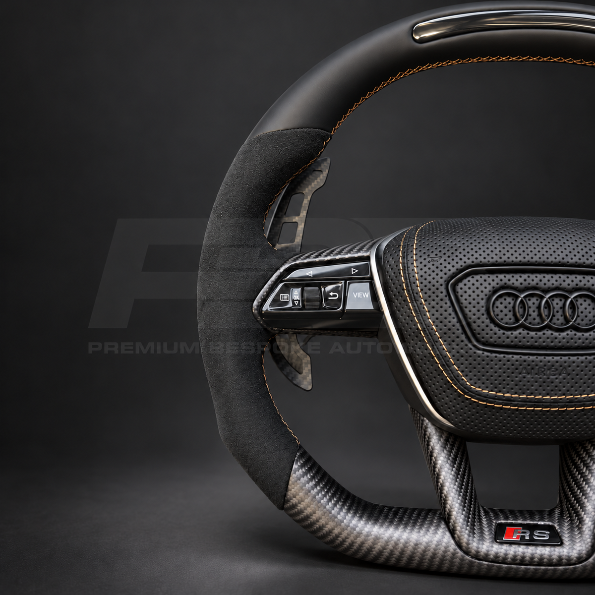 Audi RS7 4K8 custom steering wheel close up detail showing black Nappa leather top with RPM lights, matte carbon bottom, Alcantara grips and copper stitching