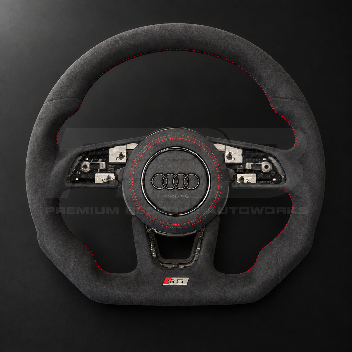 Audi S5 B9 custom steering wheel front view showing flat bottom, black Alcantara throughout, red stitching and Alcantara airbag cover