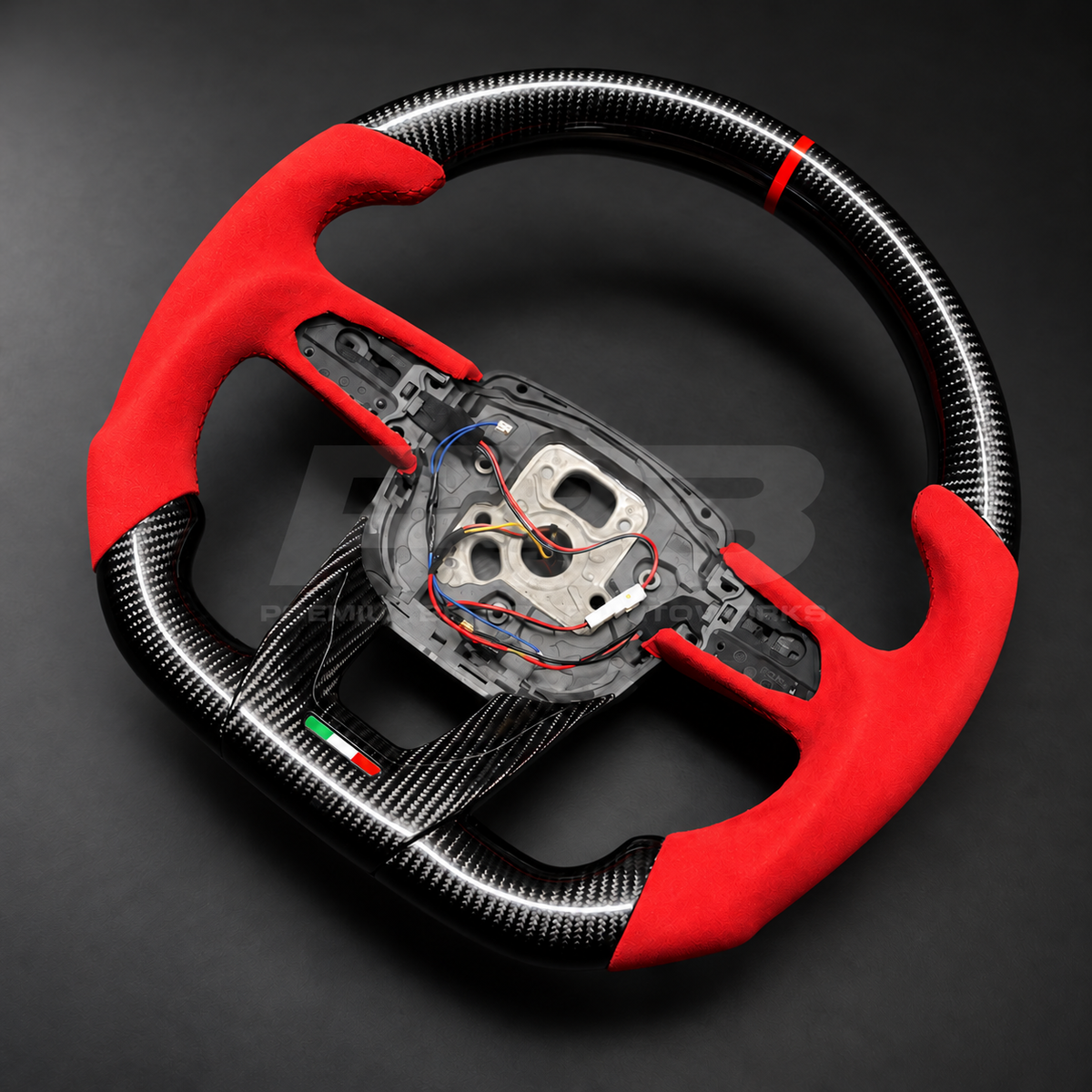 Lamborghini Urus custom steering wheel rotated to show the flat carbon fibre bottom section and Italian flag trim detail