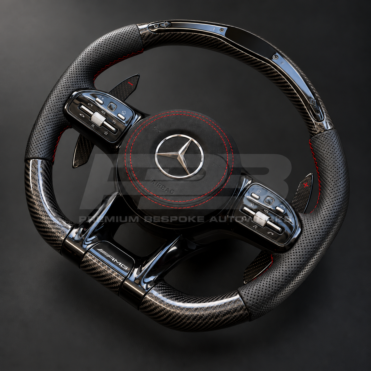 Mercedes-AMG C43 W205 Facelift custom steering wheel right angle showing gloss carbon fibre top and bottom, RPM lights bar, black perforated leather grips, red stitching and Alcantara airbag cover