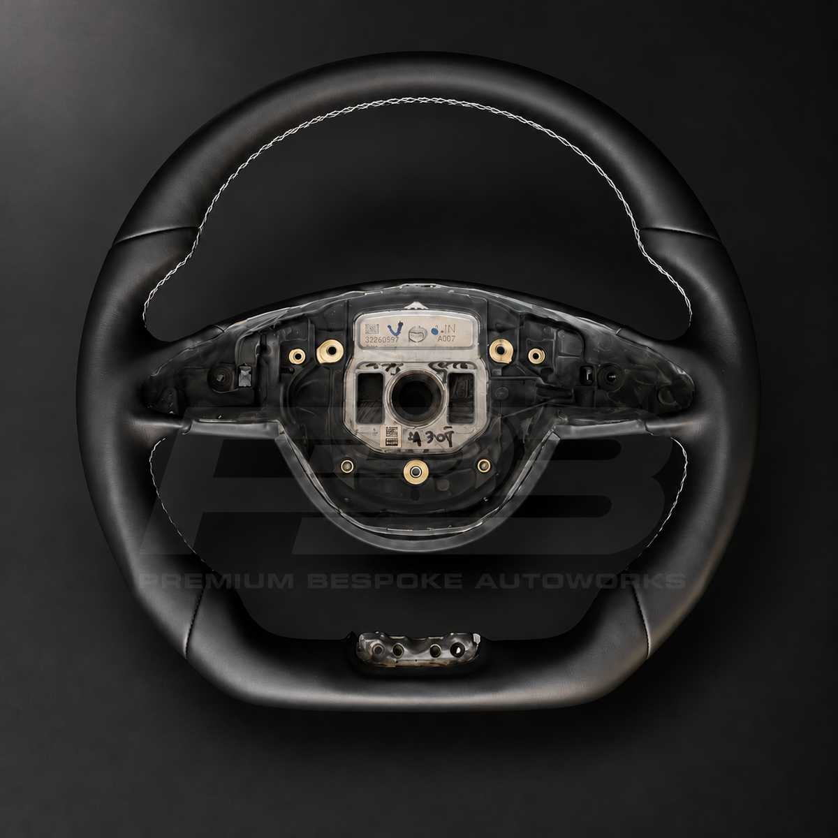 Mercedes-AMG S63 W222 custom steering wheel front view showing flat bottom, smooth black leather and white stitching