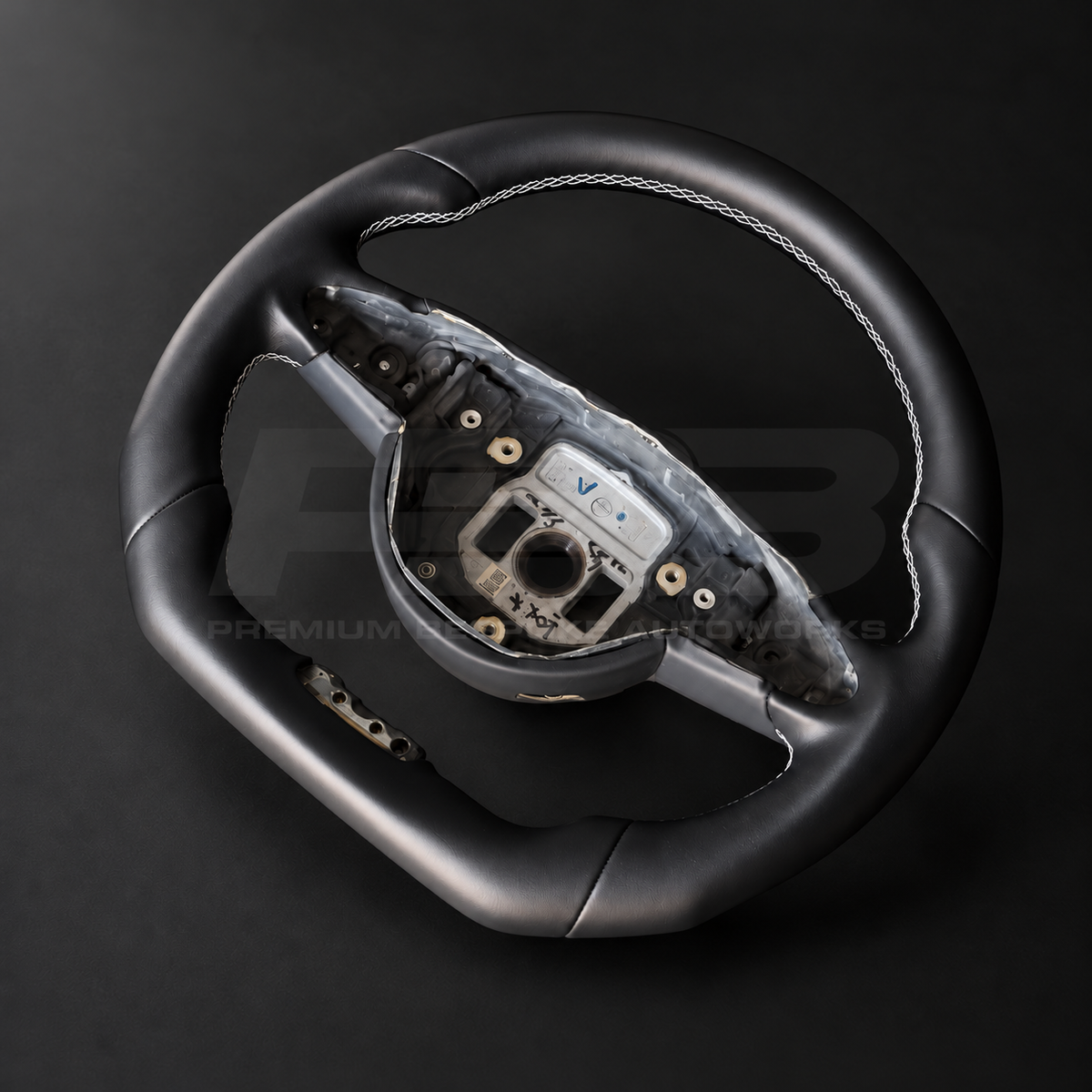 Mercedes-AMG S63 W222 custom steering wheel right angle showing flat bottom, smooth black leather and white stitching