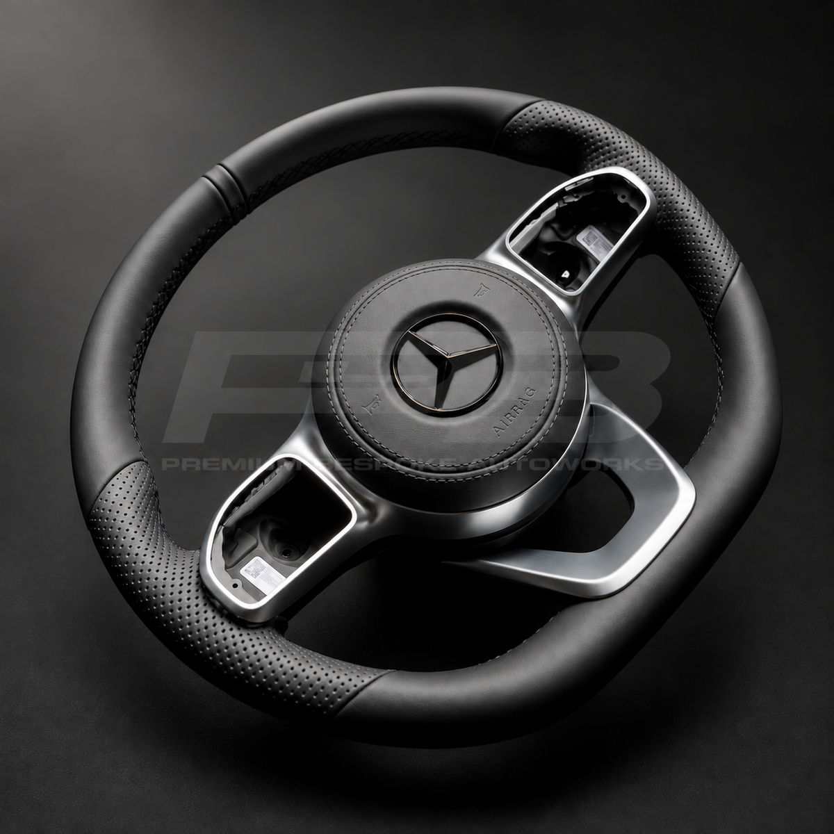 Mercedes-Benz CLS C257 custom steering wheel close up detail showing flat bottom, smooth black leather, perforated grips, black stitching, leather airbag cover, factory silver spokes