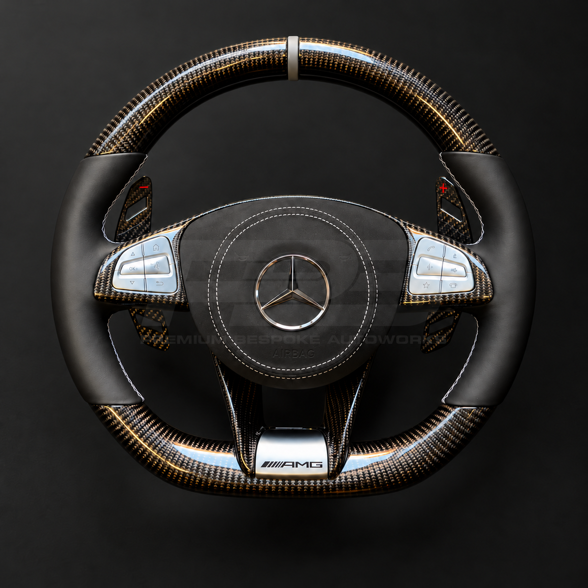 Mercedes-AMG S63 W222 custom steering wheel front view, gloss carbon fibre top and bottom, black nappa leather grips, grey marker, Alcantara airbag cover