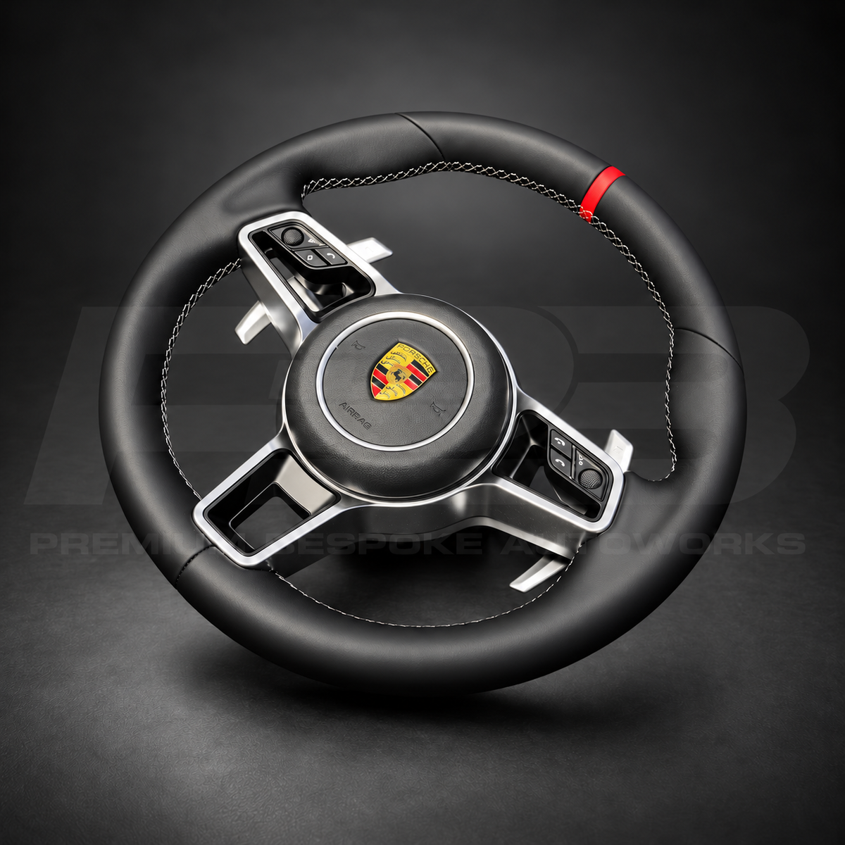 Porsche 911 991.2 custom steering wheel left angle showing black Nappa leather, grey stitching, red 12 o'clock marker and silver paddles