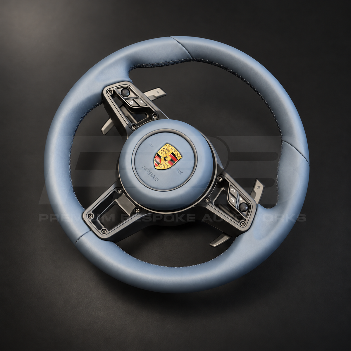 Porsche 911 997 steering wheel upgrade left angle showing a 991.2 wheel in full blue leather with matching blue leather airbag cover and silver paddles