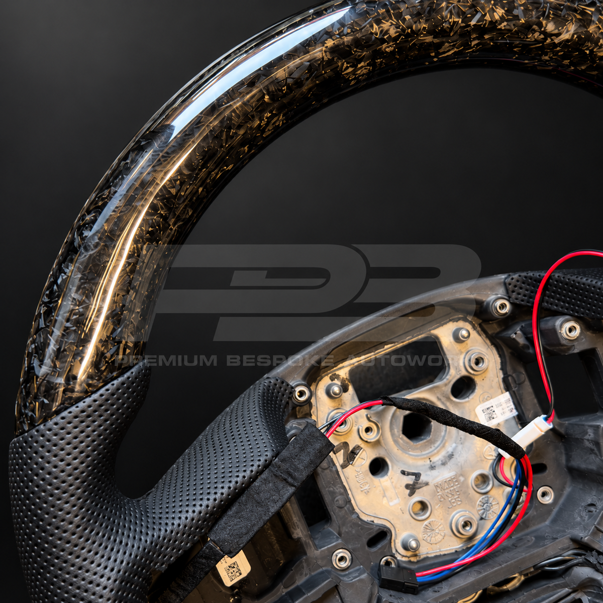 Range Rover Sport L461 custom steering wheel, close view of the marbled forged carbon weave and perforated black leather grip