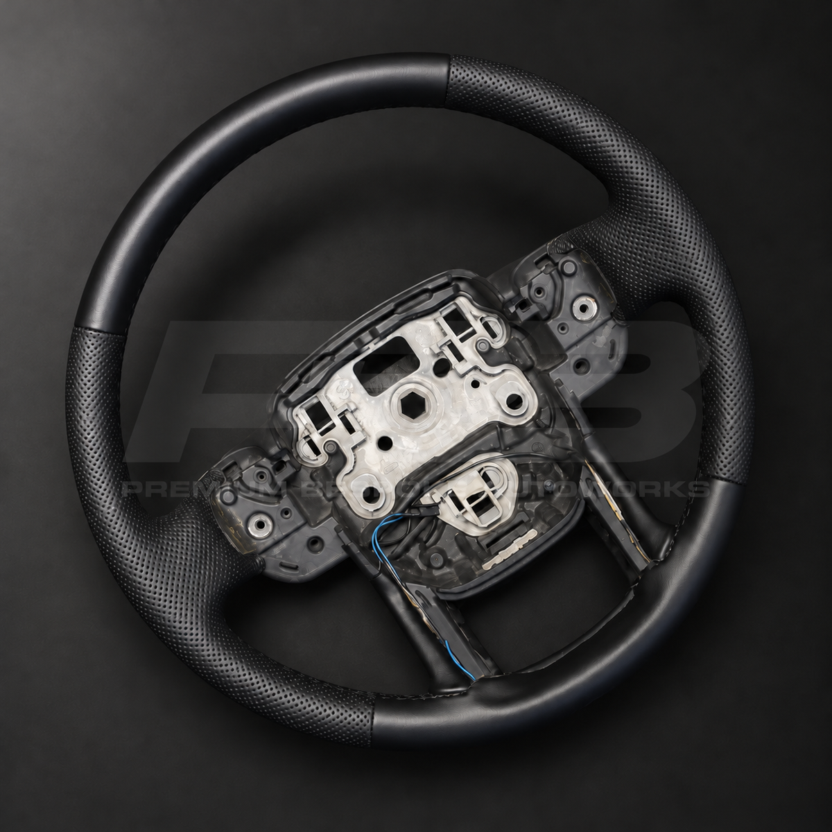 Range Rover Sport L494 custom steering wheel rotated to show the perforated black leather grips and smooth leather top section
