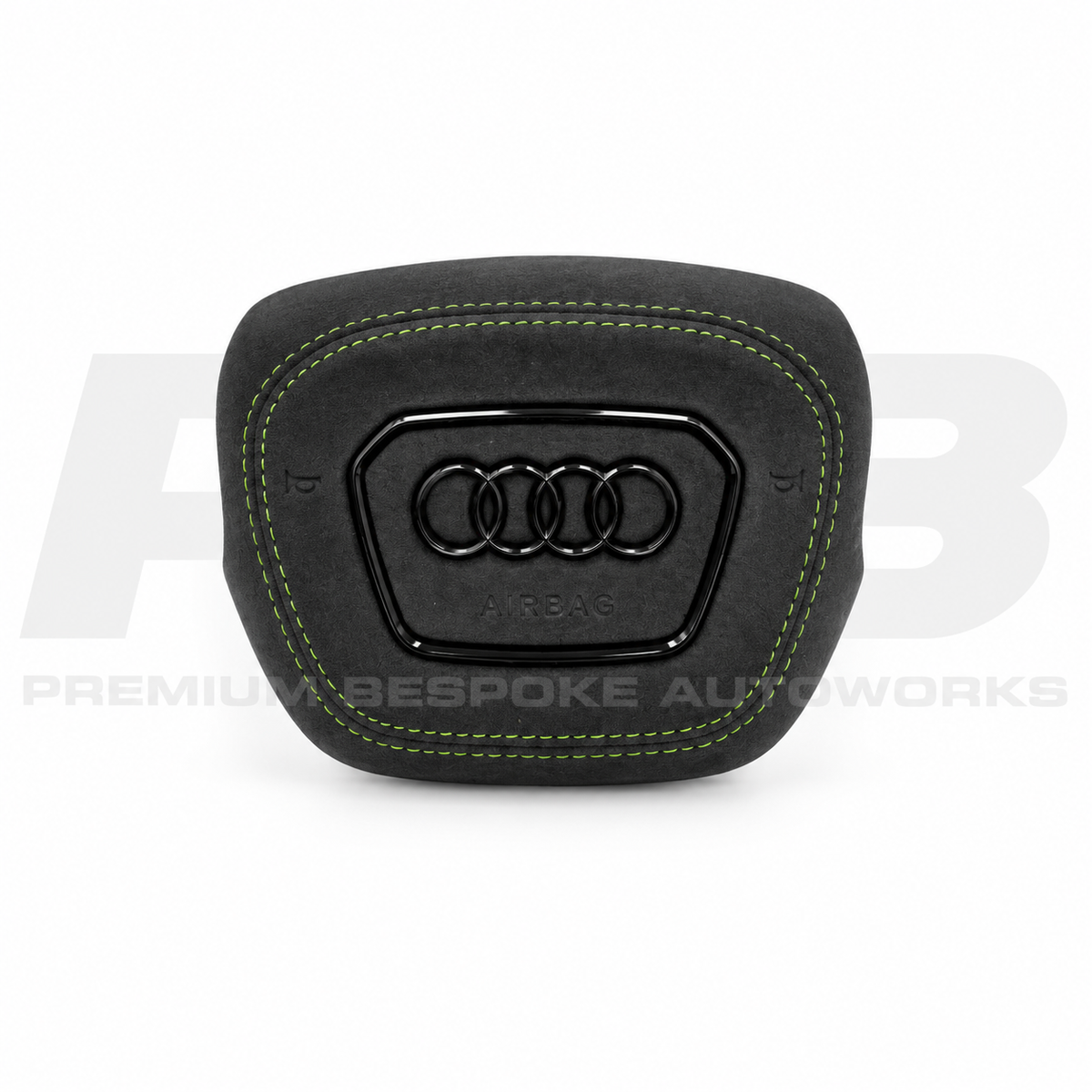 Audi RS3 8Y custom airbag cover in black Alcantara with green contrast stitching, front view, replaces the original plastic cover