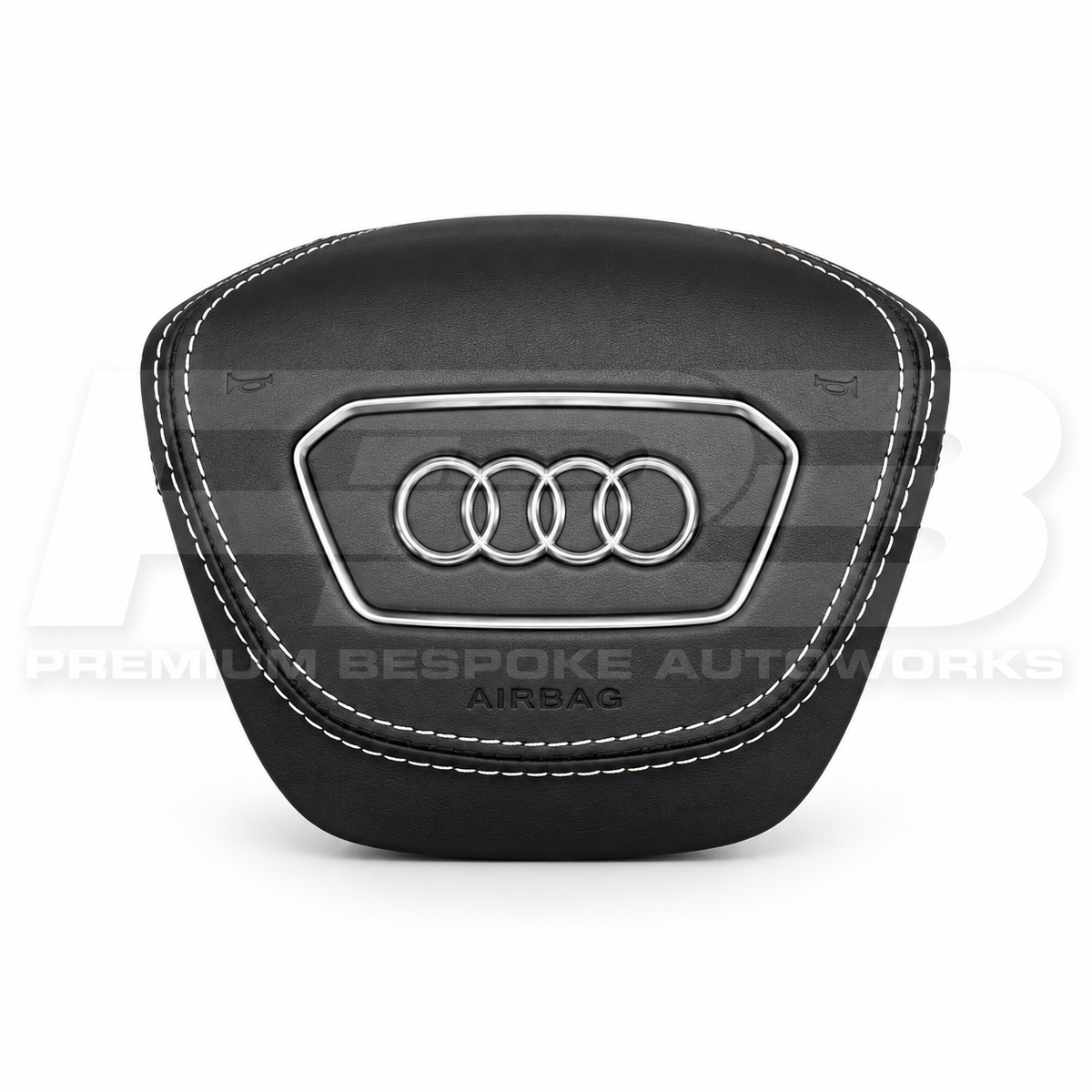 Audi RS6 C8 custom airbag cover in black leather with white contrast stitching, front view, replaces the original plastic cover