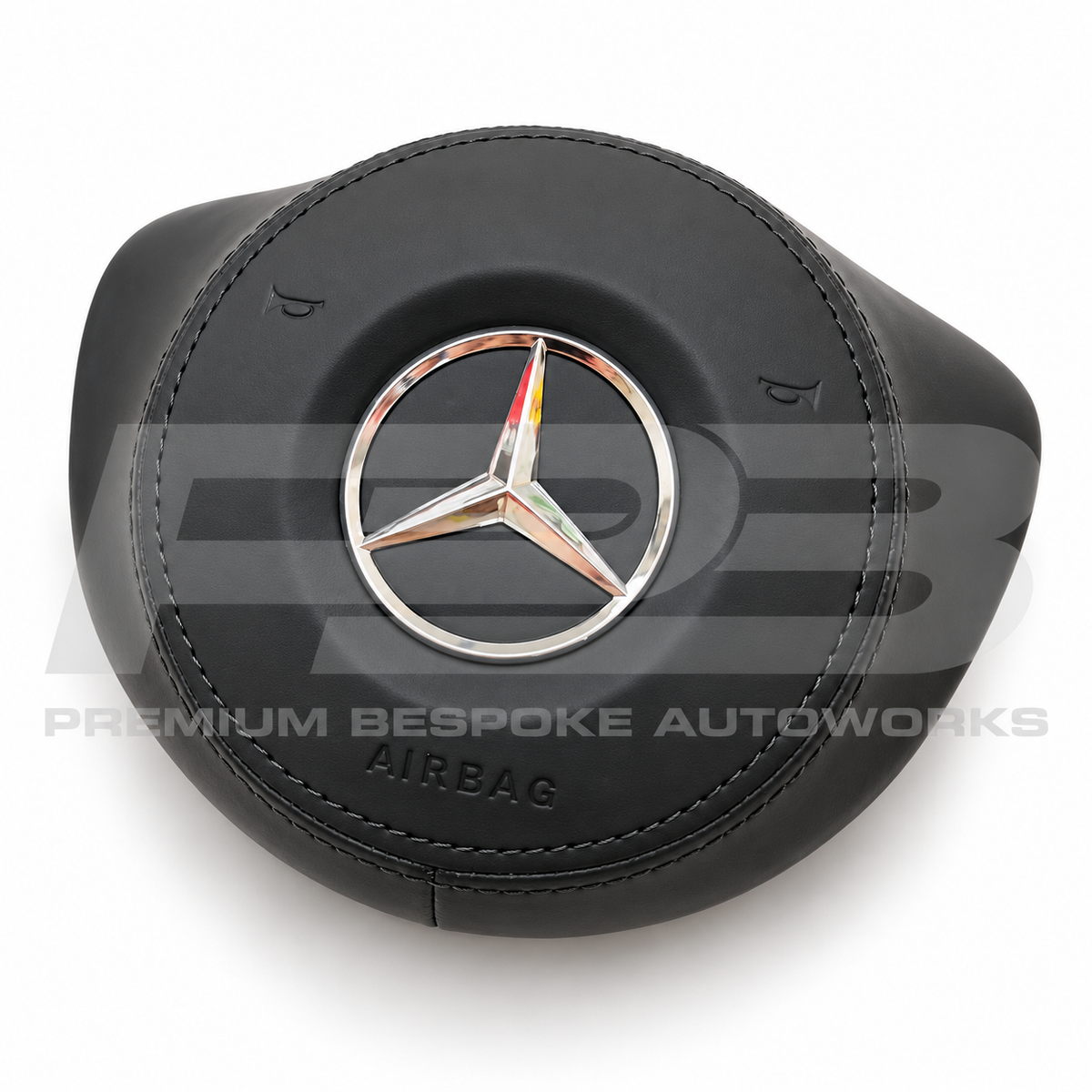 Mercedes C43 AMG W205 custom airbag cover in black leather, angled view showing the fit over the original airbag unit
