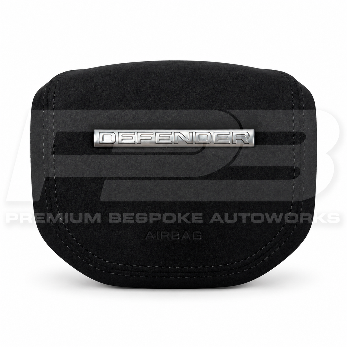 Land Rover Defender L663 custom airbag cover in black Alcantara with black stitching, front view, replaces the original plastic cover