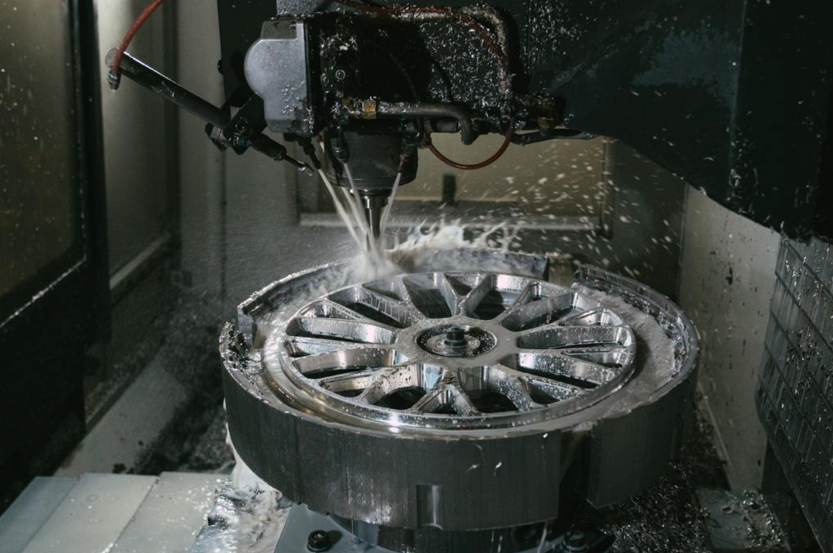 A forged wheel being machined from a single billet
