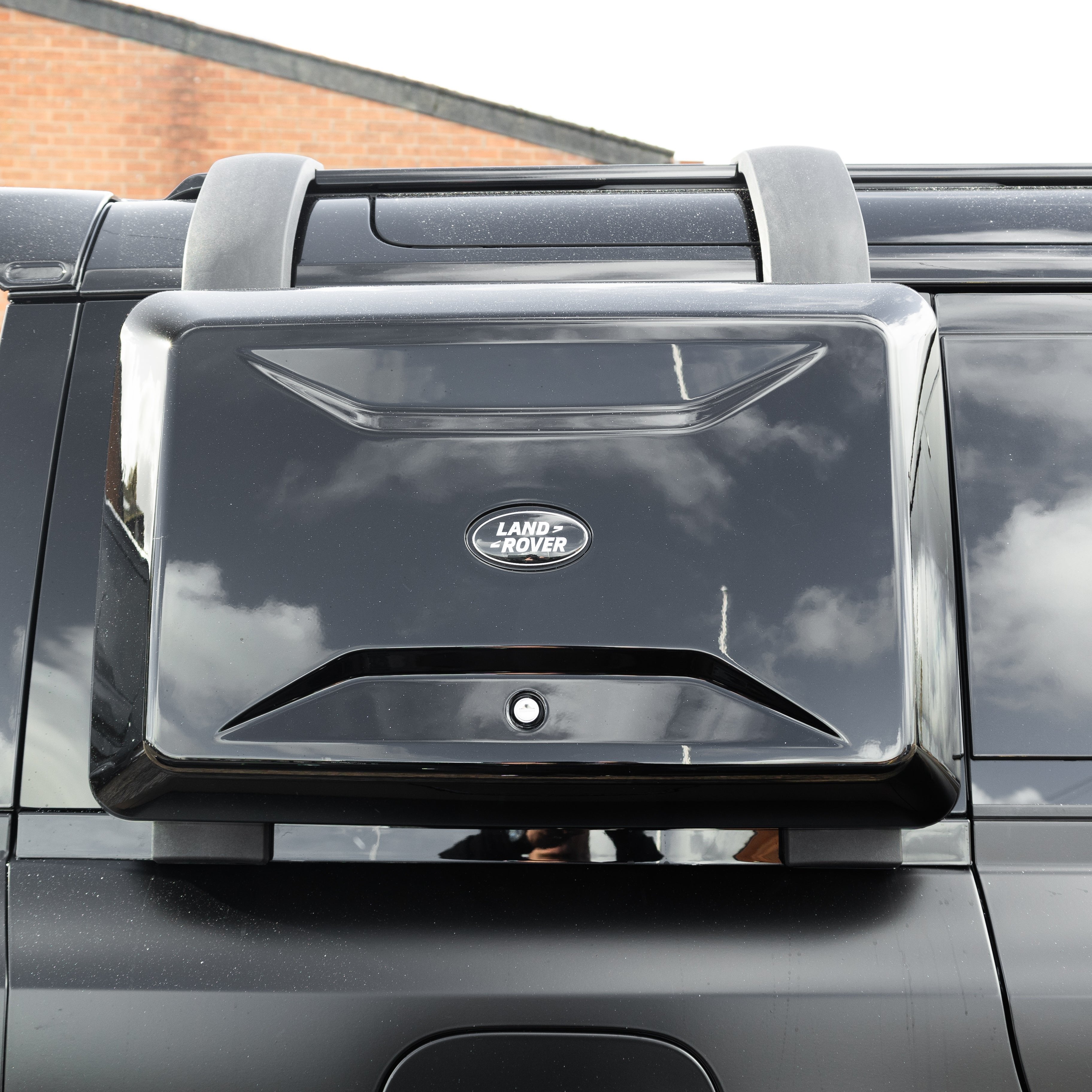 Gloss black side storage box for defender