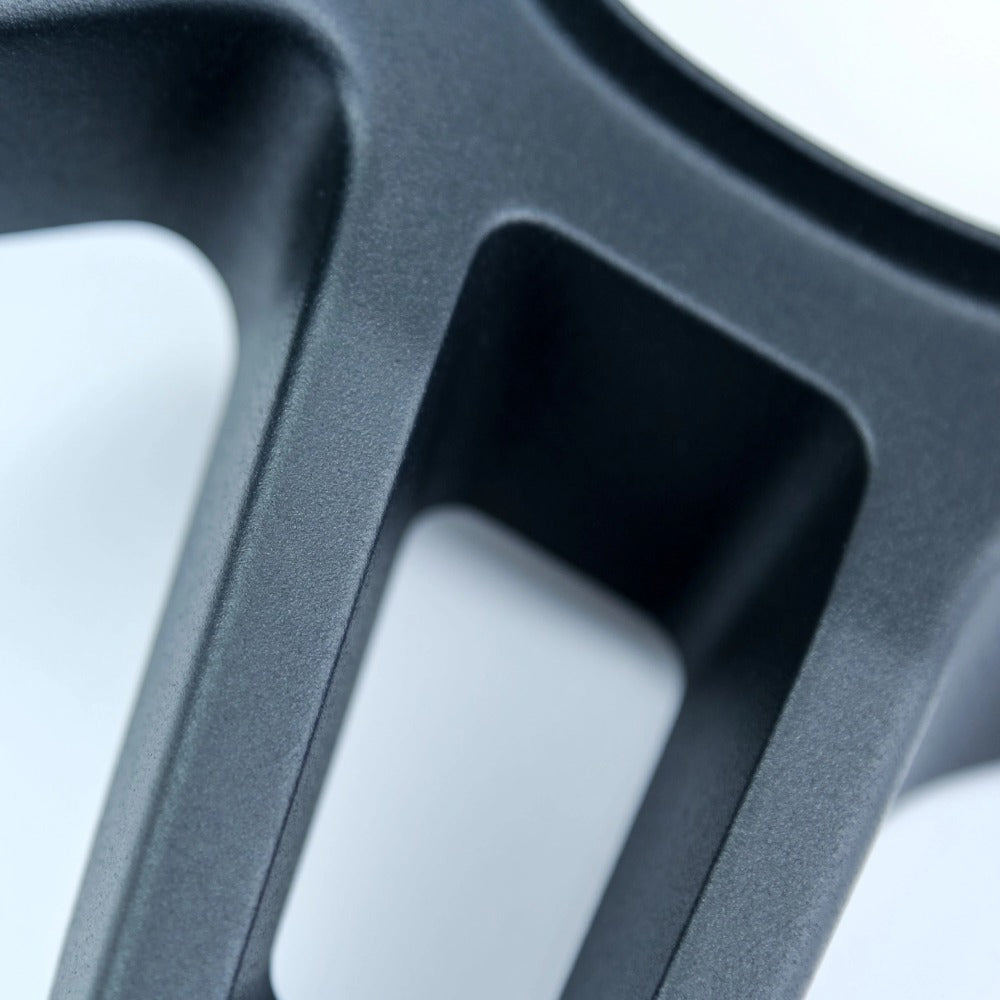 Land Rover defender L663 grey metal steering wheel trim close up image