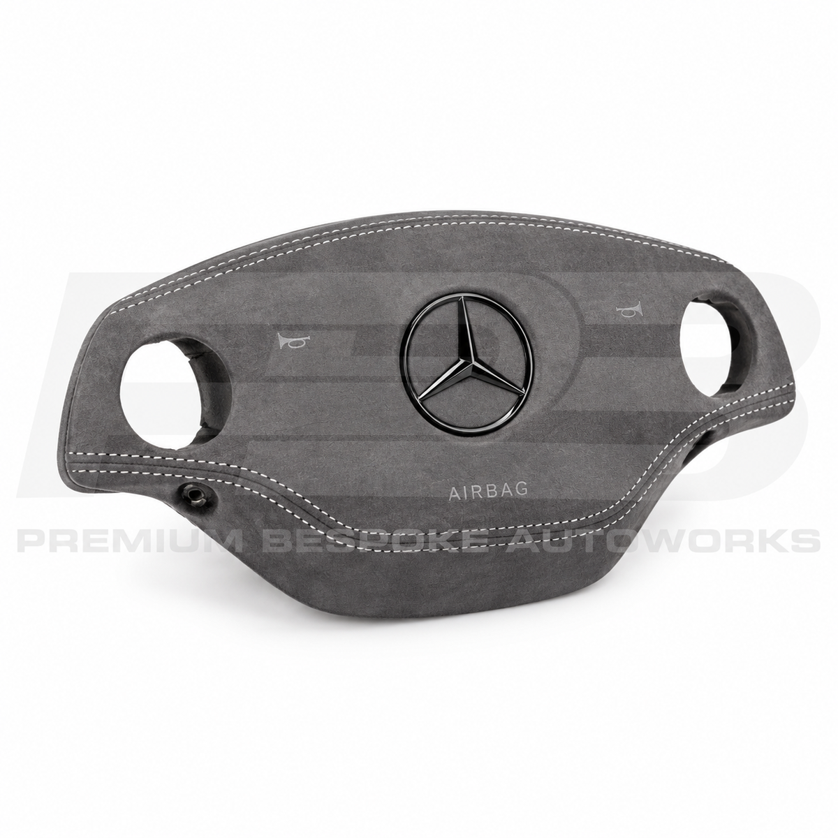 Mercedes CL C216 custom airbag cover in grey Alcantara with white stitching, angled view showing the fit over the original airbag unit