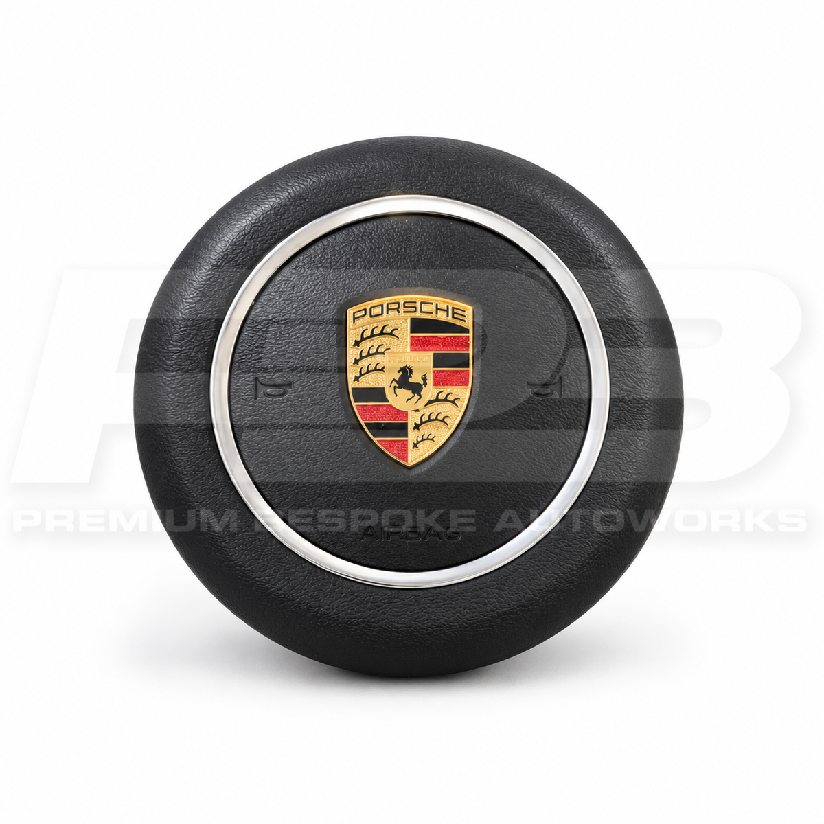 Porsche 911 991.2 custom airbag cover in black leather with silver trim ring, front view, replaces the original plastic cover