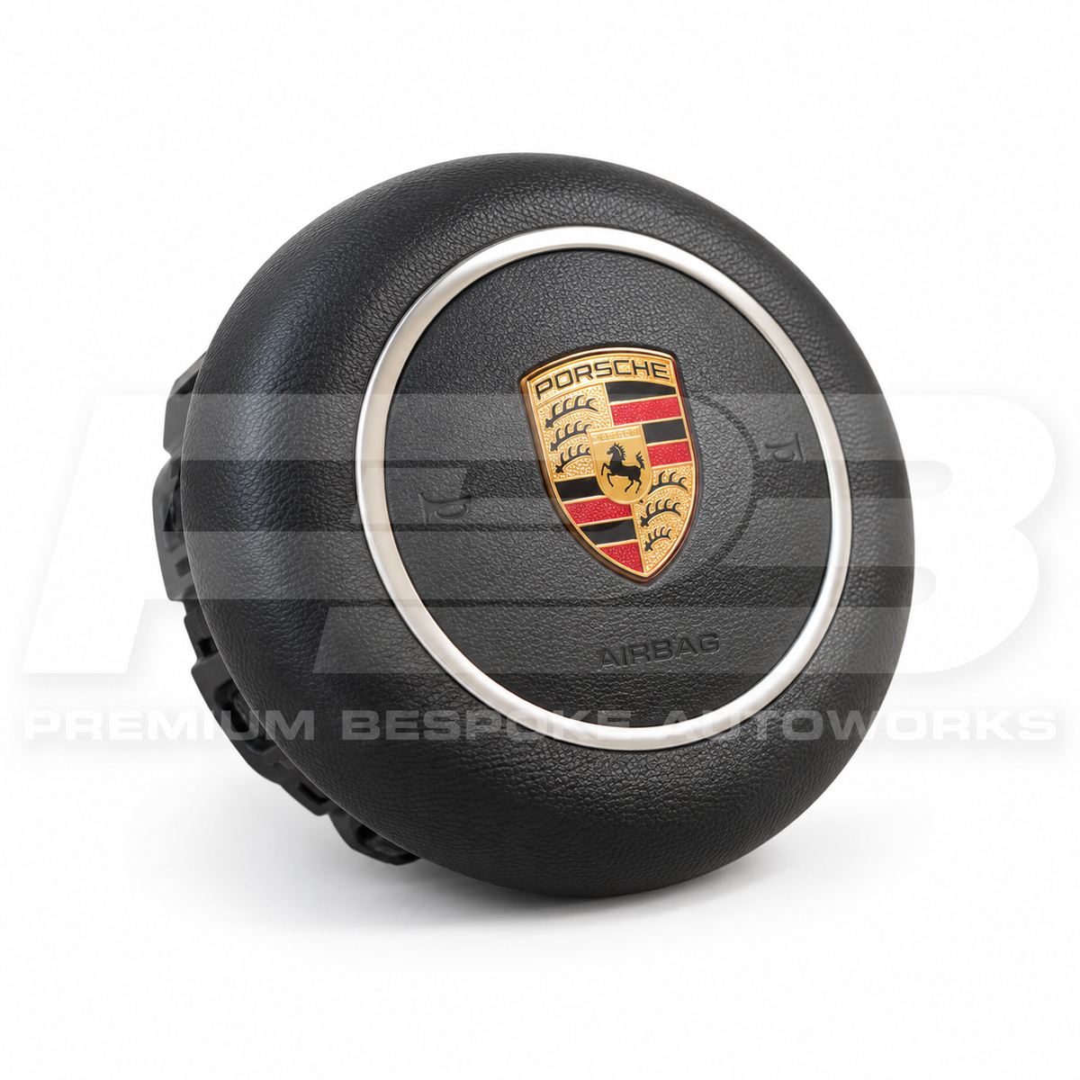 Porsche 911 991.2 custom airbag cover in black leather, angled view showing the fit over the original airbag unit