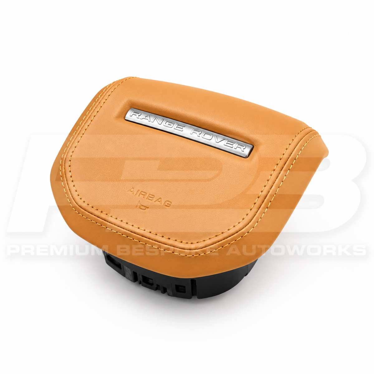 Range Rover Sport L461 custom airbag cover in tan leather, angled view showing the fit over the original airbag unit