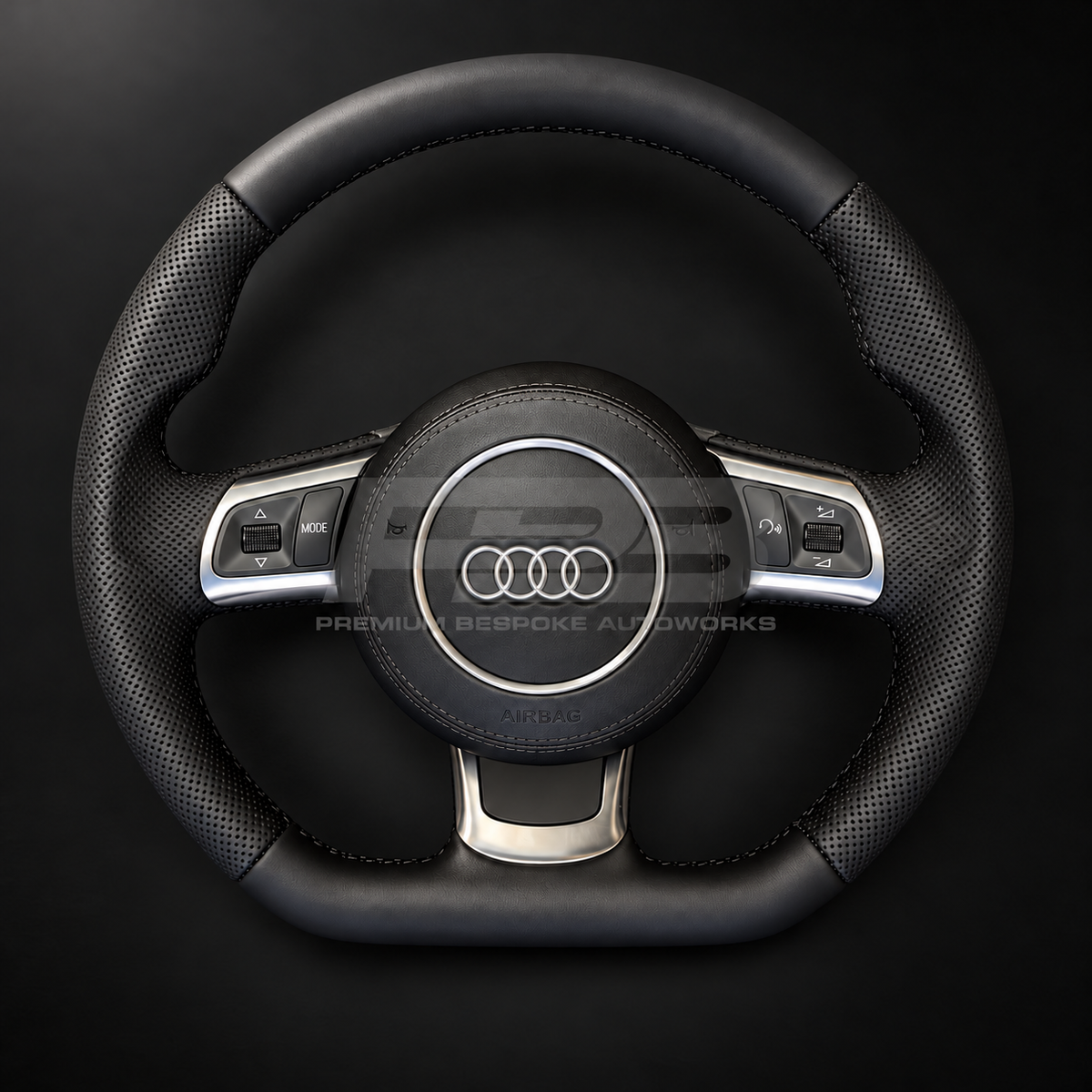 Audi R8 Gen 1 custom steering wheel, front view, smooth black leather with perforated grips, black stitching, leather airbag cover and silver trims, complete and ready to fit, customer build by Premium Bespoke AutoWorks