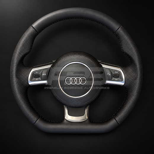 Audi R8 Gen 1 custom steering wheel, front view, smooth black leather with perforated grips, black stitching, leather airbag cover and silver trims, complete and ready to fit, customer build by Premium Bespoke AutoWorks