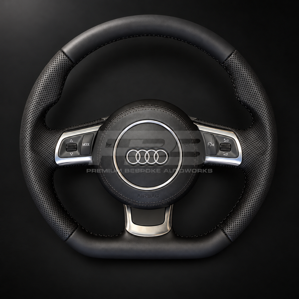 Audi R8 Gen 1 custom steering wheel, front view, smooth black leather with perforated grips, black stitching, leather airbag cover and silver trims, complete and ready to fit, customer build by Premium Bespoke AutoWorks