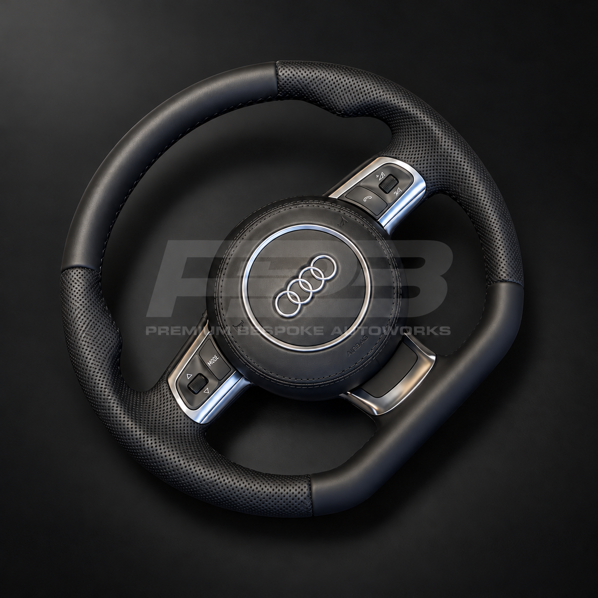 Audi R8 Gen 1 custom steering wheel rotated to show the perforated black leather grips and smooth leather top section