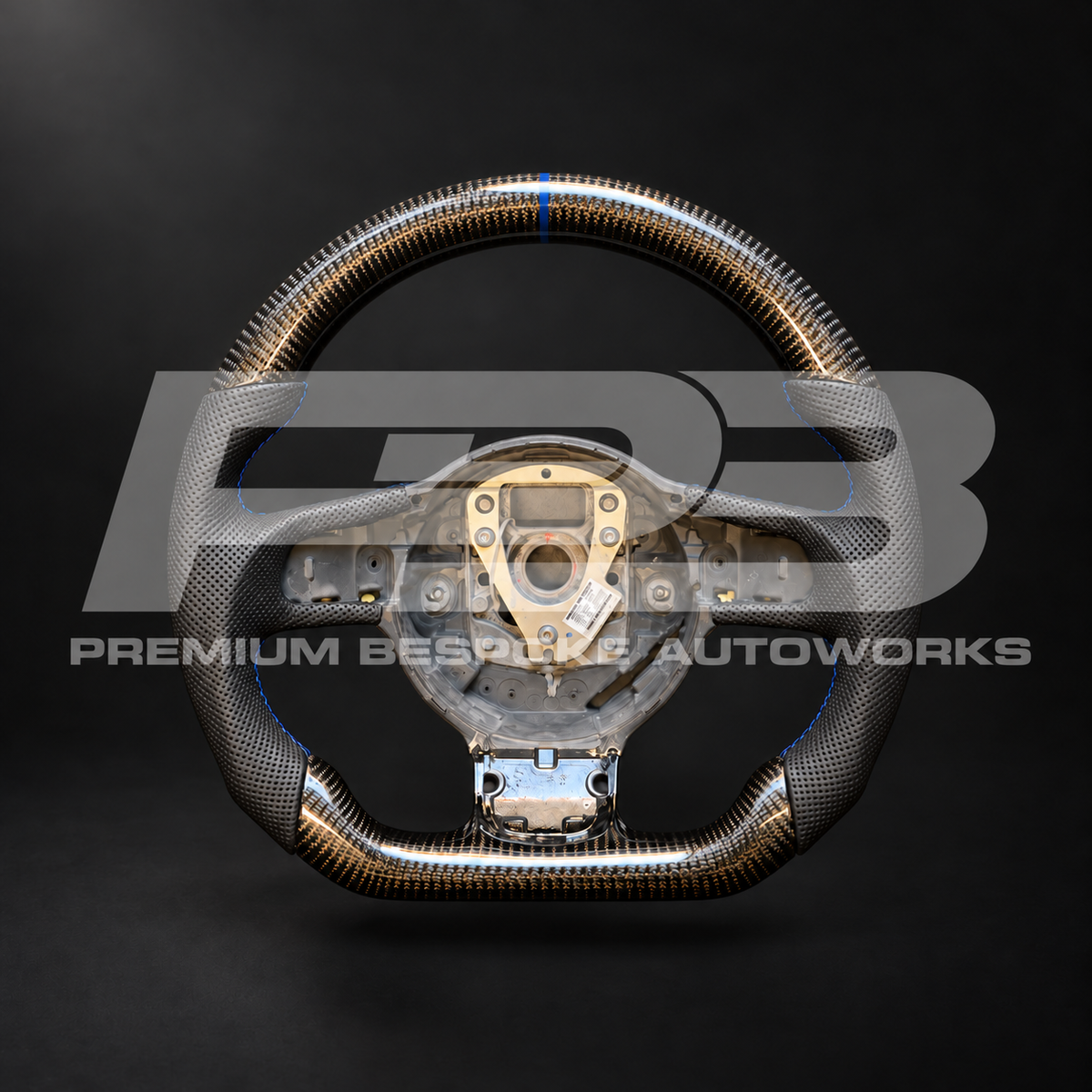 Audi R8 Gen 1 custom steering wheel, front view: flat bottom, gloss carbon fibre top and bottom, perforated black leather grips, navy blue stitching and 12 o'clock marker