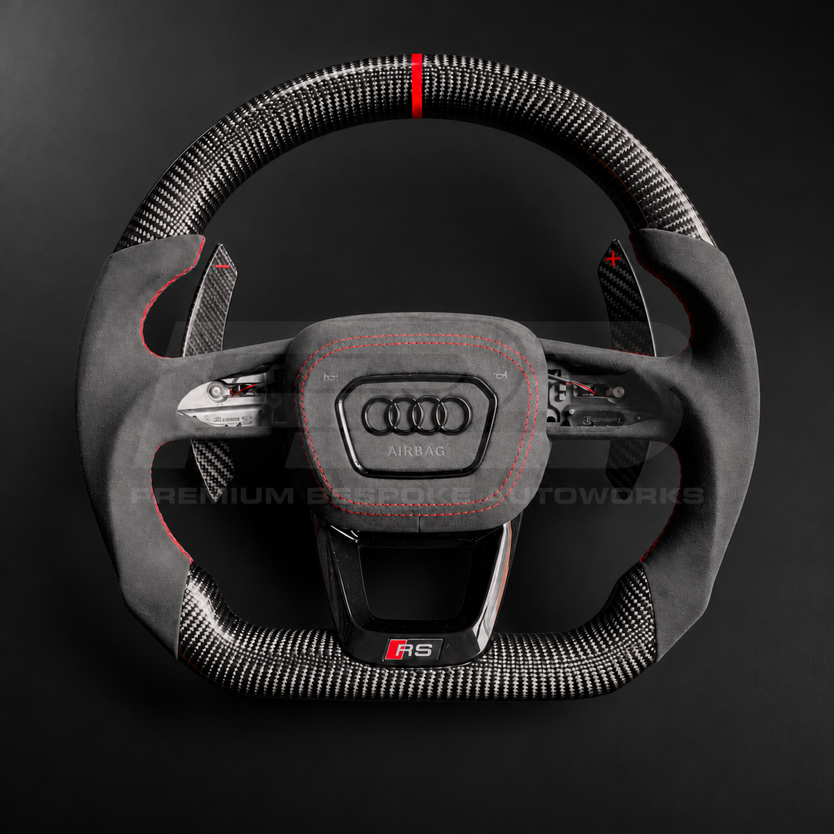 Audi RS3 8Y custom steering wheel front view, flat bottom, gloss carbon fibre top and bottom, red 12 o'clock marker, black Alcantara grips and airbag cover with red stitching