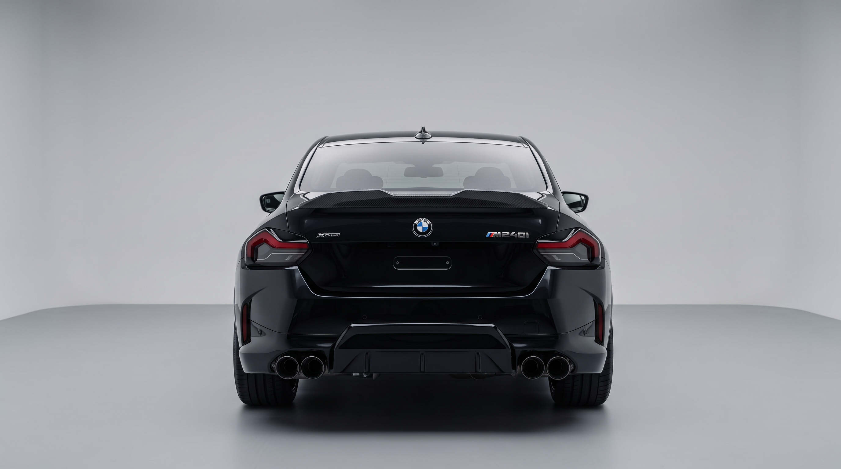 BMW M2 G87 & M240i G42 pre-preg carbon fibre rear spoiler fitted to a gloss black 2 Series - Premium Bespoke AutoWorks