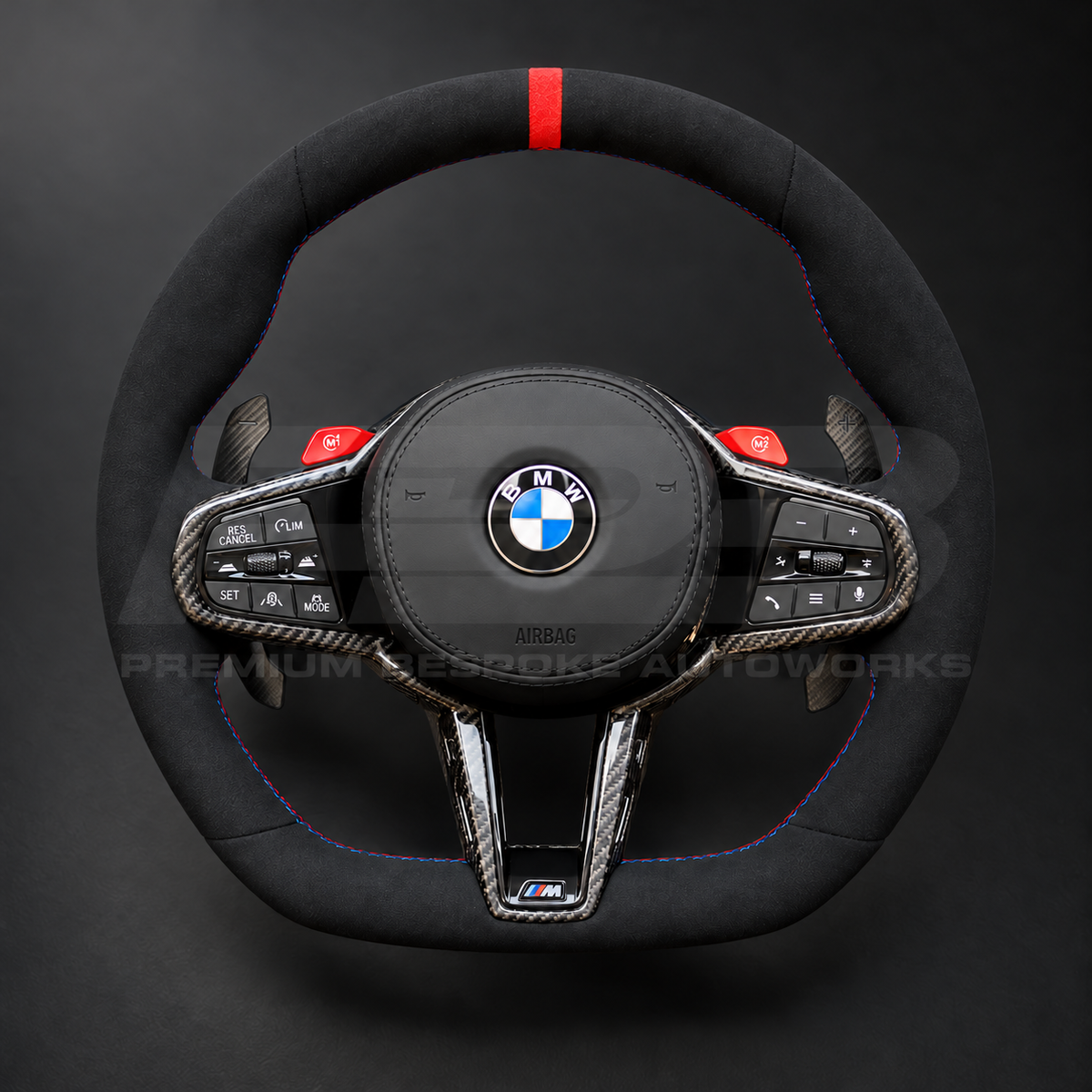 BMW M4 G82 LCI custom steering wheel front view, full black Alcantara, red 12 o'clock marker, M tricolour stitching, Alcantara airbag cover, carbon trims, red M buttons