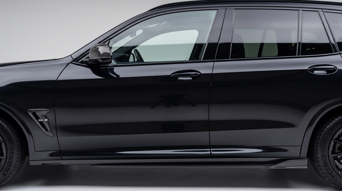 BMW X3M F97 carbon fibre side skirts fitted to a gloss black X3M, side profile - Premium Bespoke AutoWorks