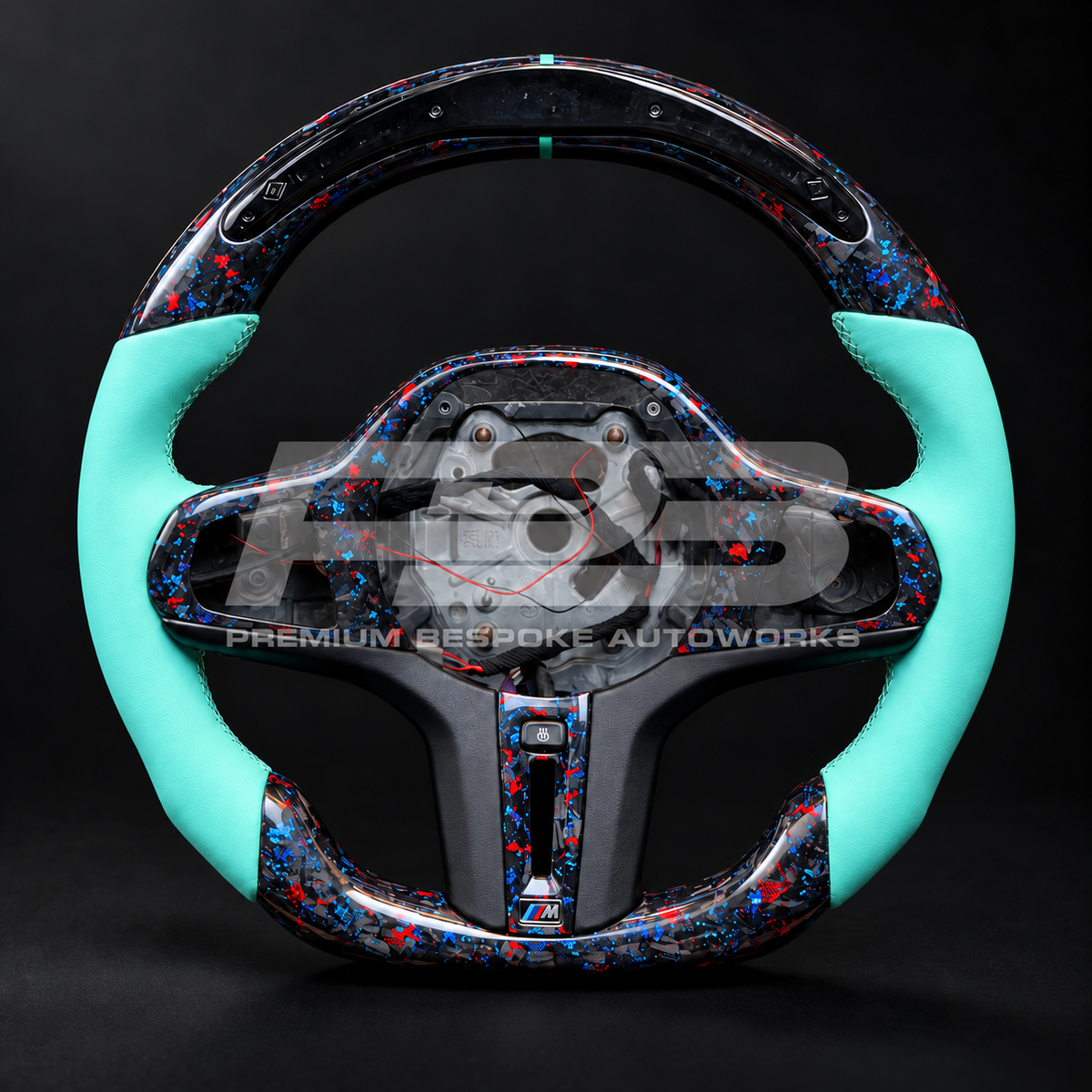 BMW Z4 G29 custom steering wheel, front view, flat bottom red and blue flecked forged carbon fibre with LED race display and Tiffany blue leather grips, customer build by Premium Bespoke AutoWorks