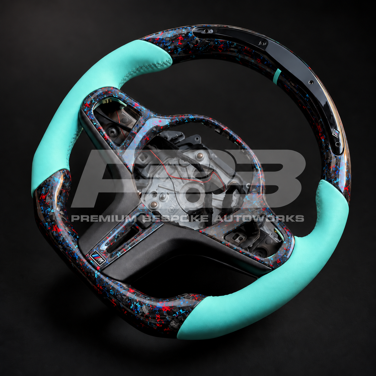 BMW Z4 G29 custom steering wheel rotated to show the forged carbon top section with LED race display and Tiffany blue marker