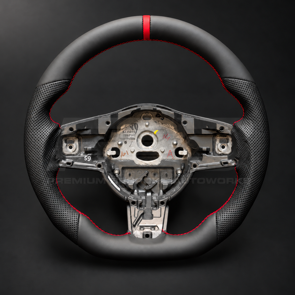 Jaguar F-Type custom steering wheel front view, flat bottom, smooth black nappa leather top and bottom, perforated grips, red stitching and red 12 o'clock marker
