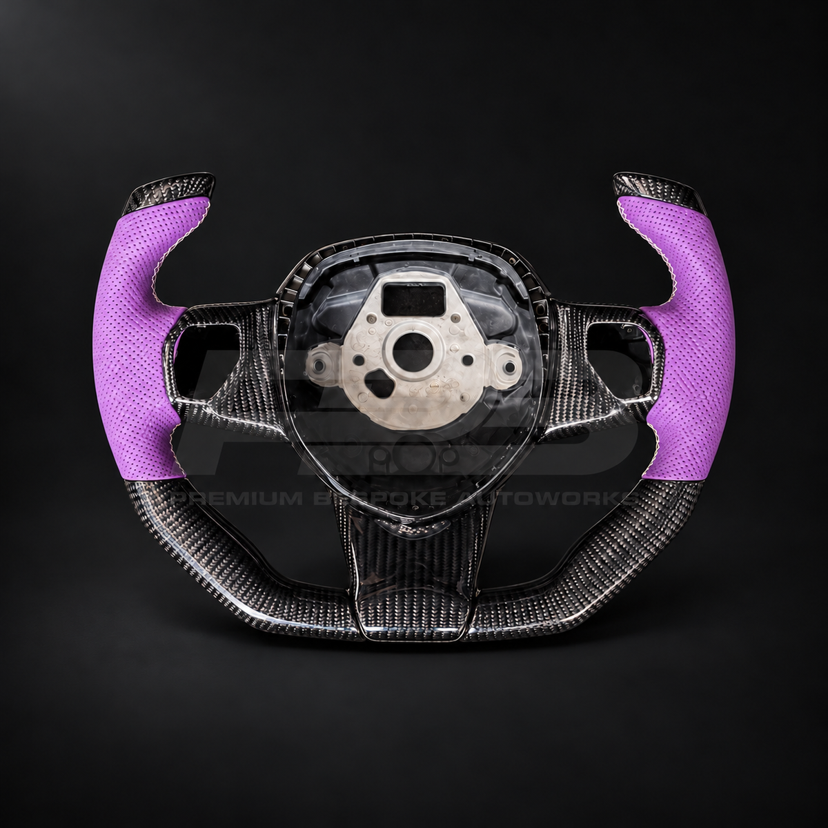 Lamborghini Aventador custom steering wheel, front view, F1 shape gloss carbon fibre with perforated purple leather grips and white stitching, customer build by Premium Bespoke AutoWorks