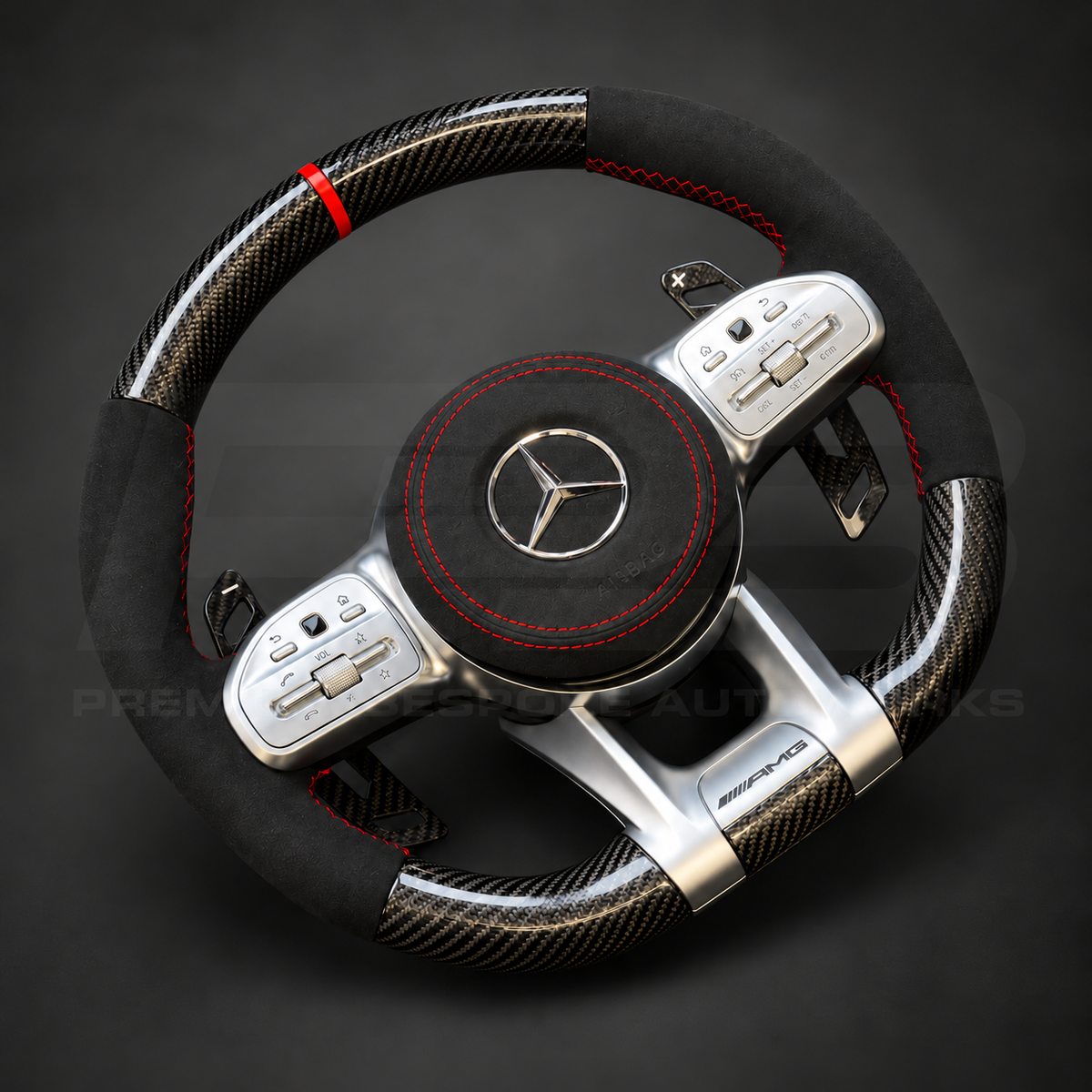 Mercedes-AMG A45 W177 custom steering wheel left angle showing gloss carbon fibre, black Alcantara grips and airbag cover, red stitching and red marker