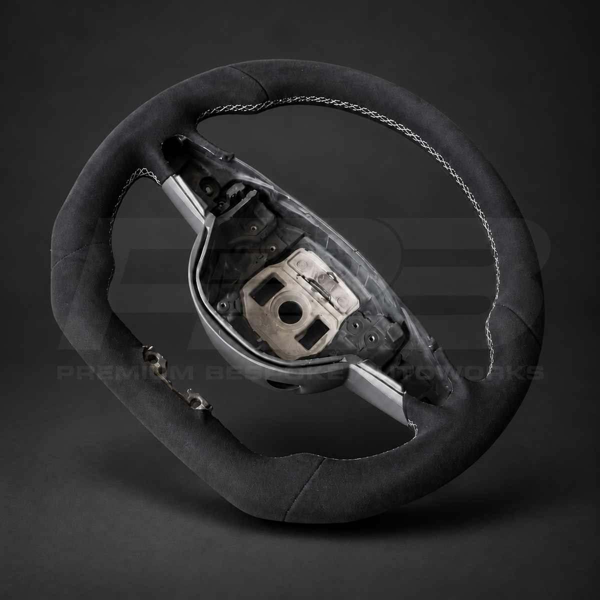 Mercedes-AMG C63 W205 custom steering wheel angled view showing flat bottom, full black Alcantara and white stitching