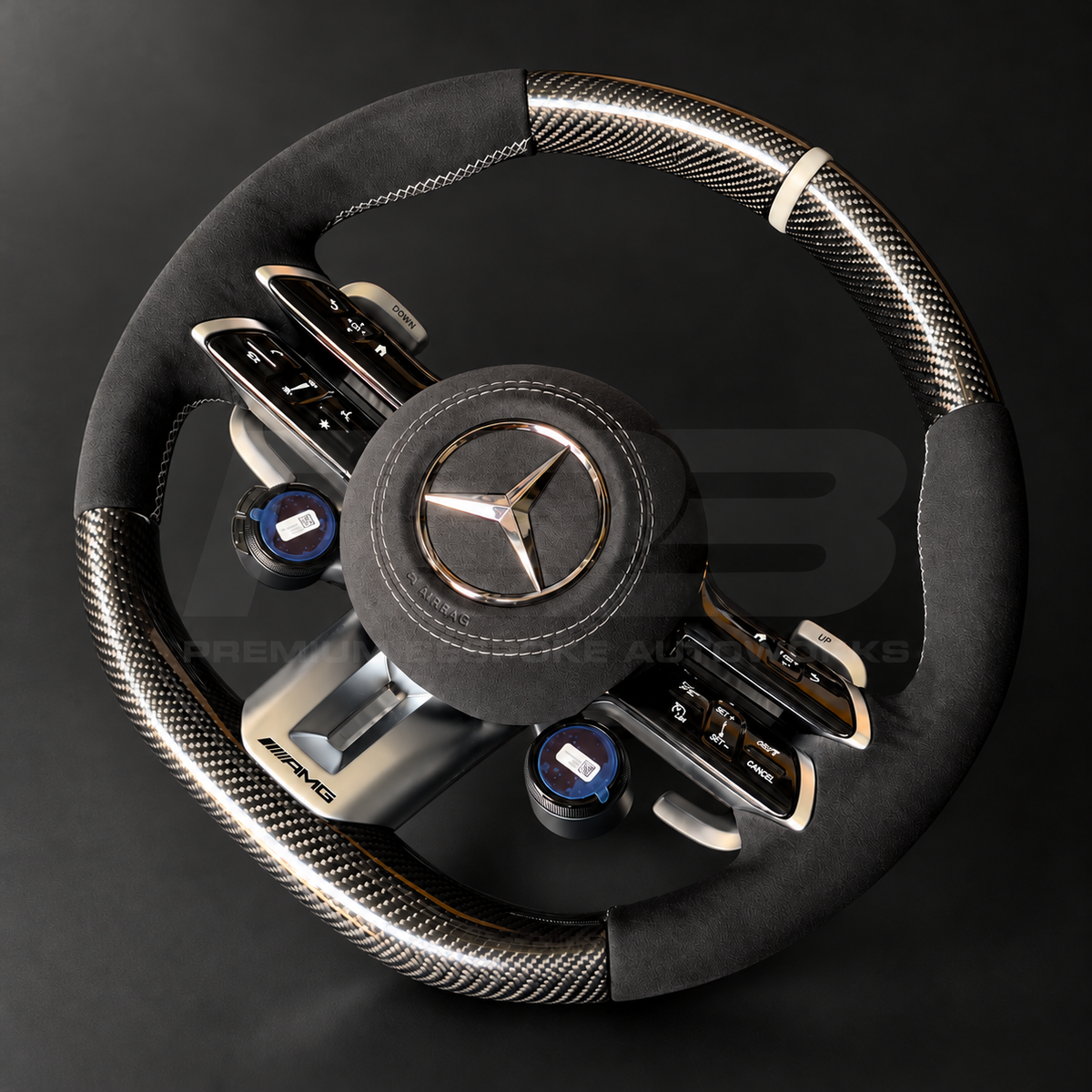 Mercedes-AMG G63 custom steering wheel front view, gloss carbon fibre top and bottom, black Alcantara grips and airbag cover, classic grey stitching and marker, AMG drive unit dials